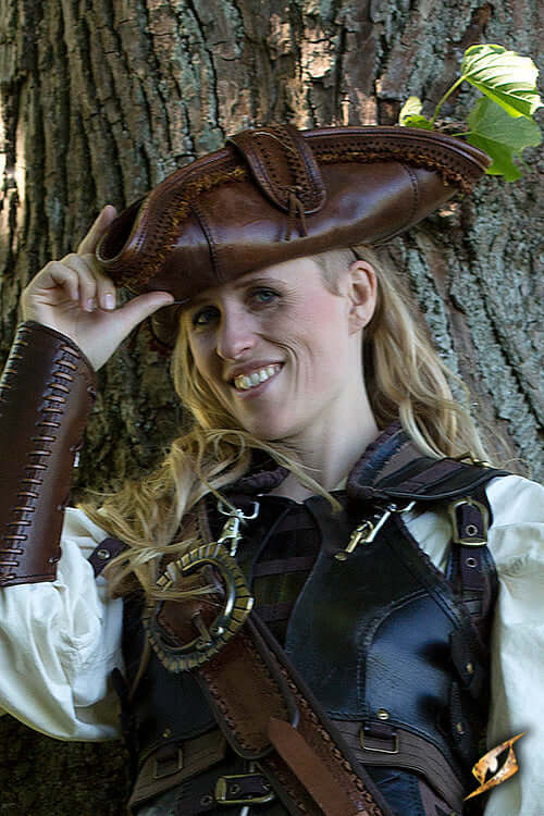 Woman wearing a stylish hat with unique design, showcasing headwear expertise in the Headwear & Hats collection.