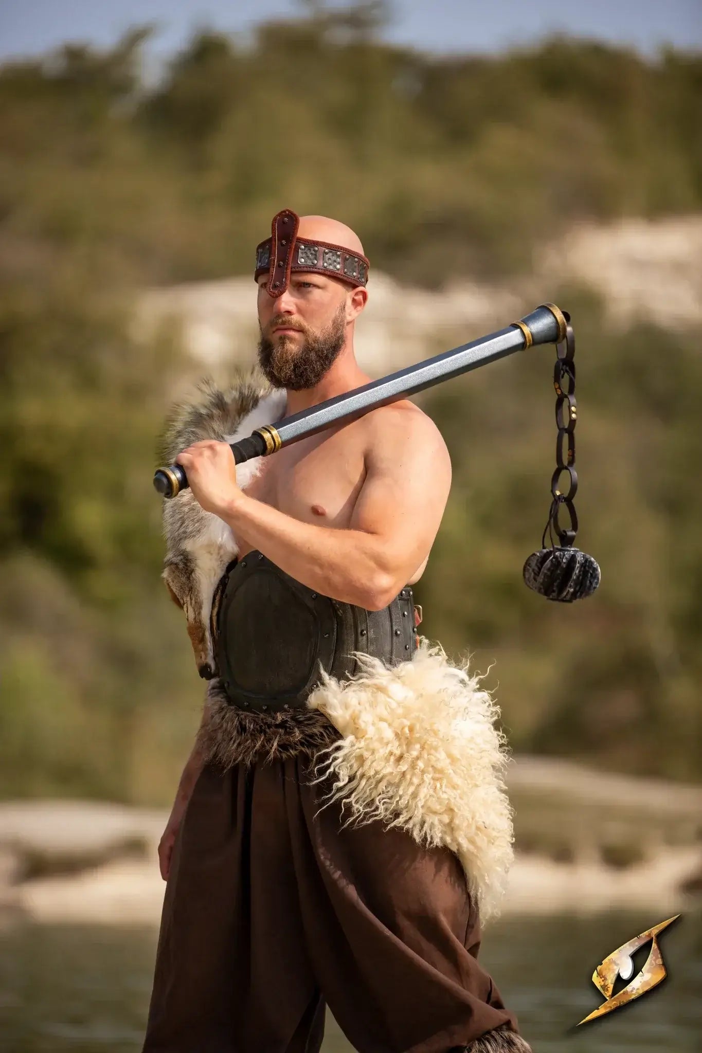A warrior showcasing their modular weapons, highlighting its unique design and powerful appearance.