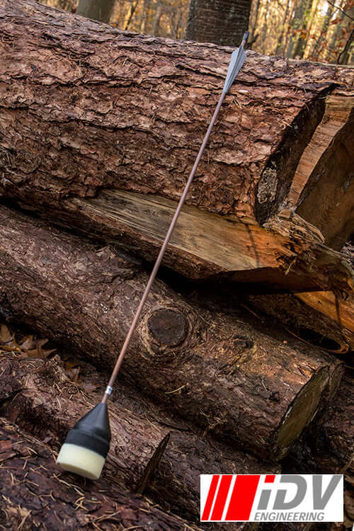IDV engineering product image featuring an arrow resting against stacked logs.