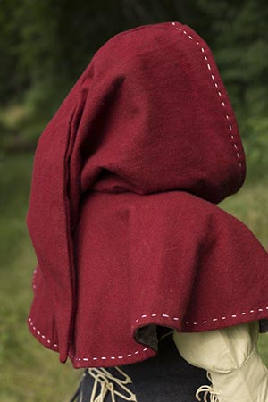 Textile hooded cloak in deep red, showcasing fine stitching details, perfect for historical re-enactments.