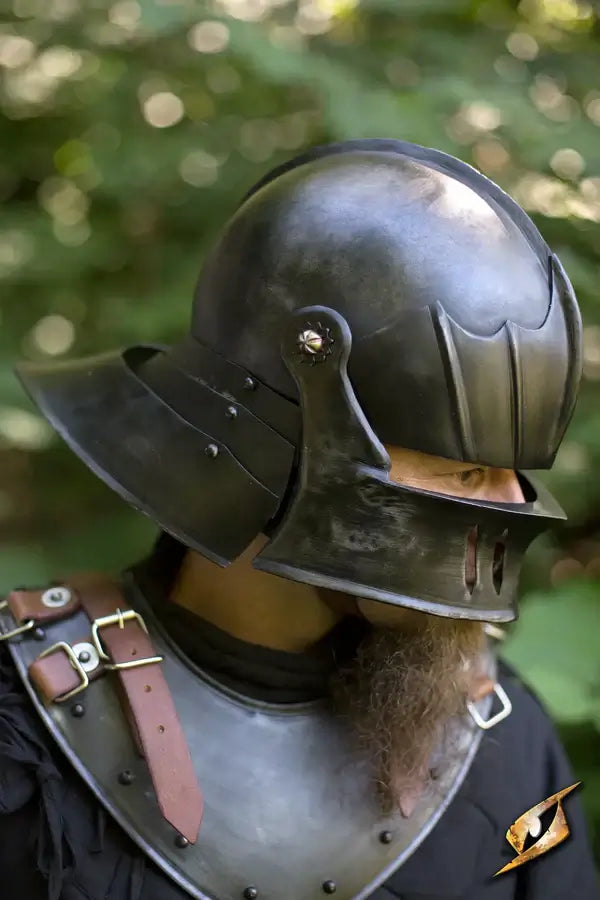 Medieval Helmets - Close-up of a knight wearing a steel helmet, showcasing strength and craftsmanship.