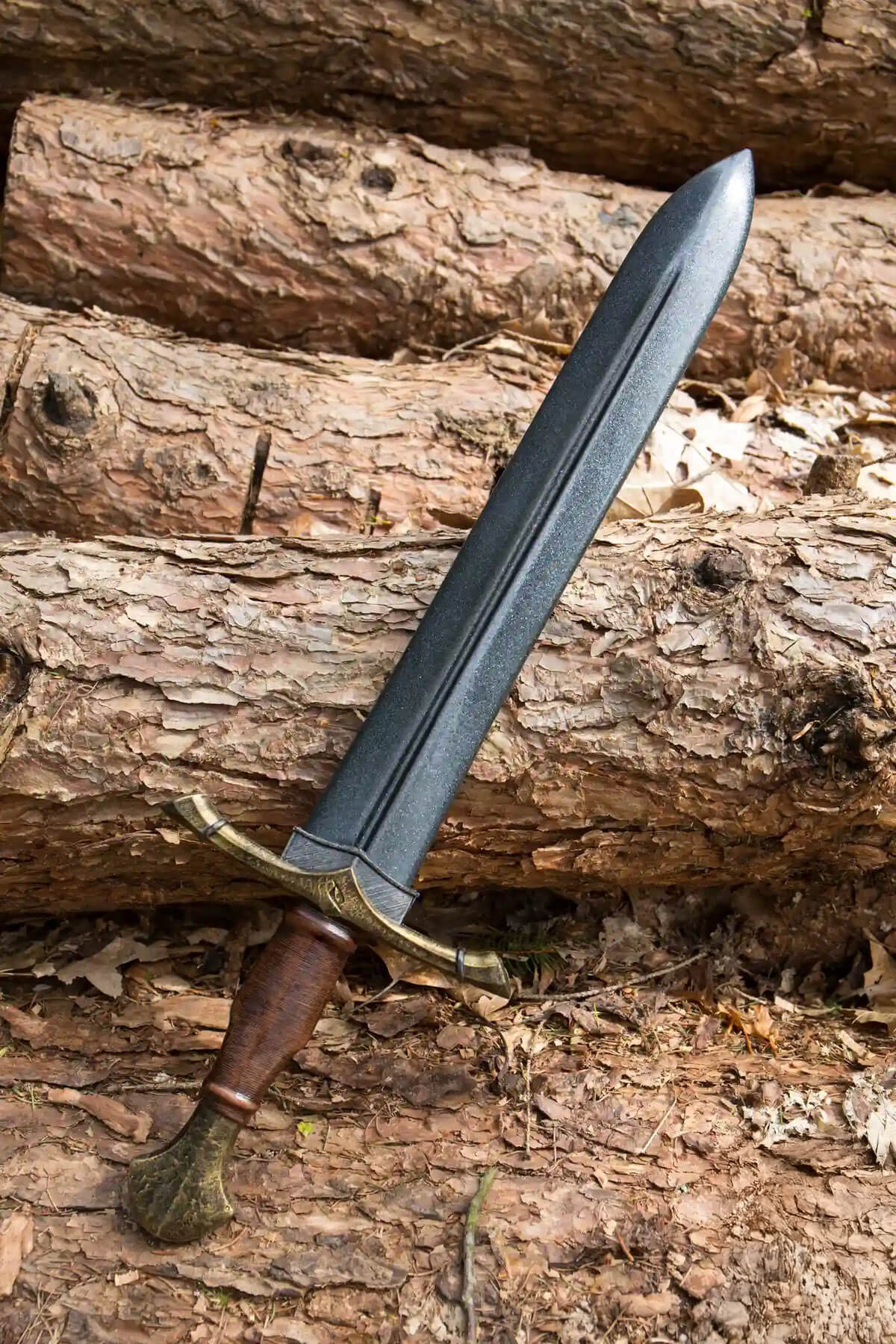 Short Swords displayed on wooden logs, highlighting their compact design and versatility.