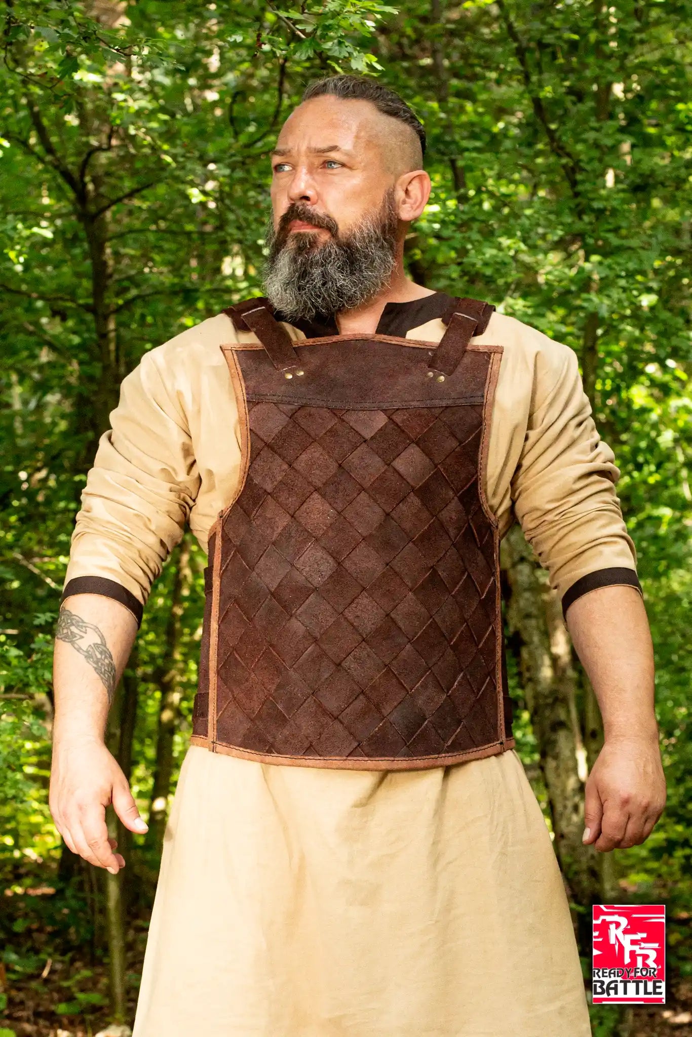 RFB Viking Leather Armour displayed by a man outdoors, made from dark brown leather in a distinctive woven design.