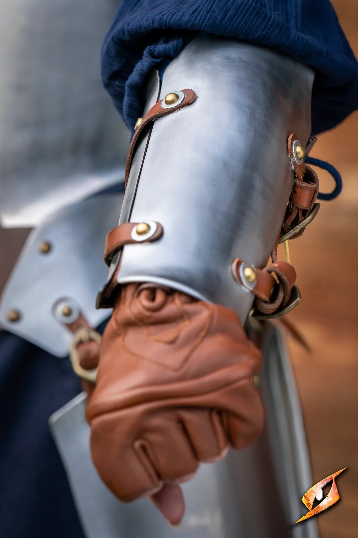 Close-up of Renegade Vambraces showing steel and leather design, crafted for durability and movement.