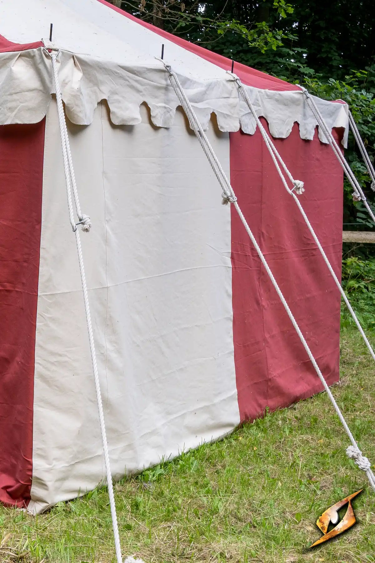 Marquee Tent - Sides - 5x8m with red and white fabric, secured with ropes in a grassy area.