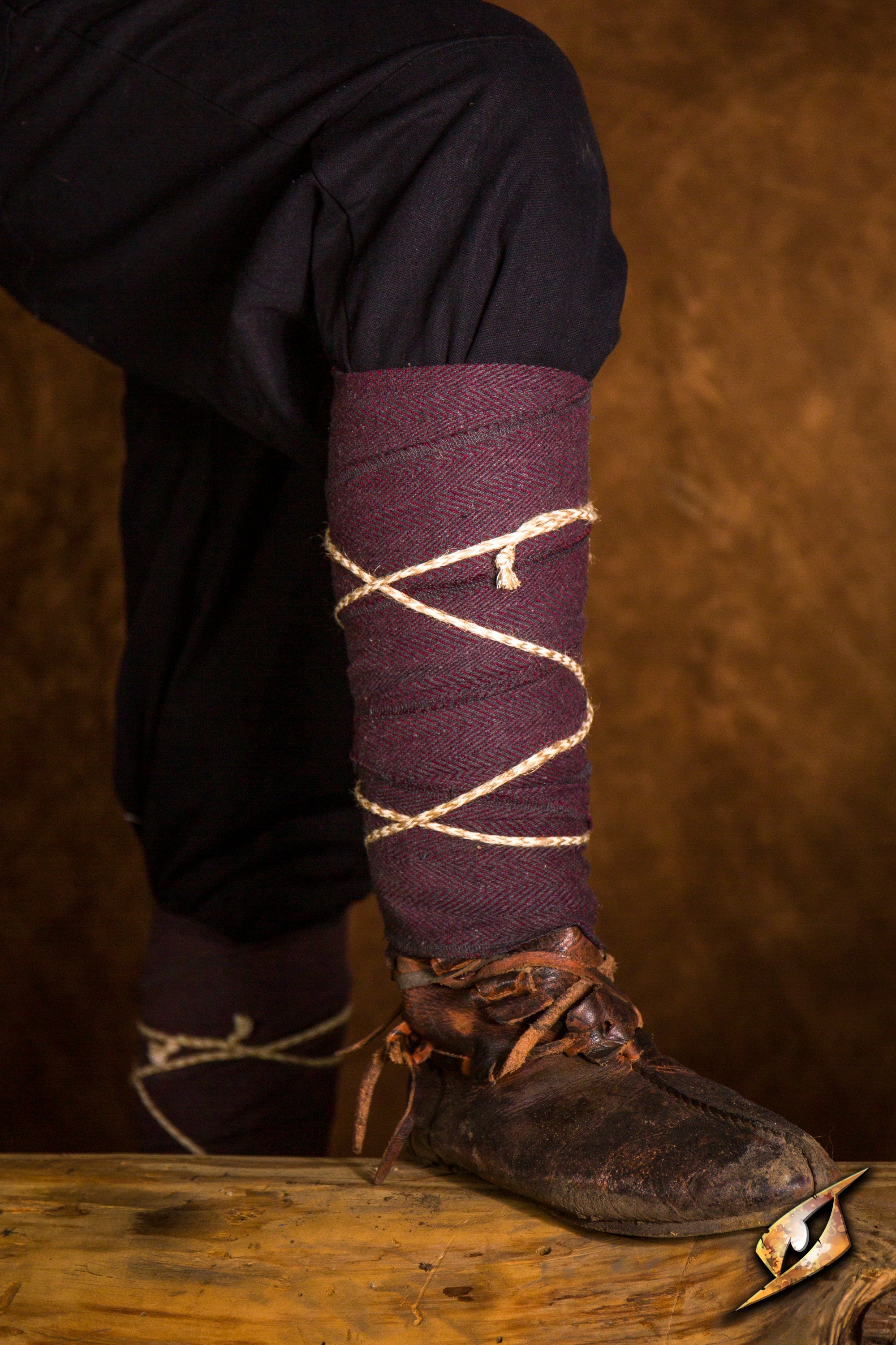 Woodland Leg Wraps shown on a model, featuring a stylish lacing design with rustic boots.
