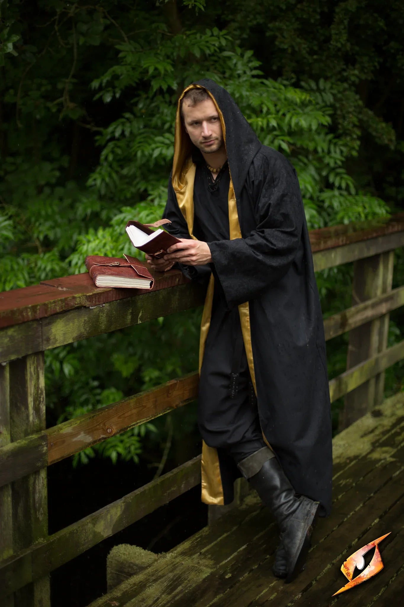 A magician wearing a Magician Robe stands on a bridge, reading from a spellbook amid lush greenery.