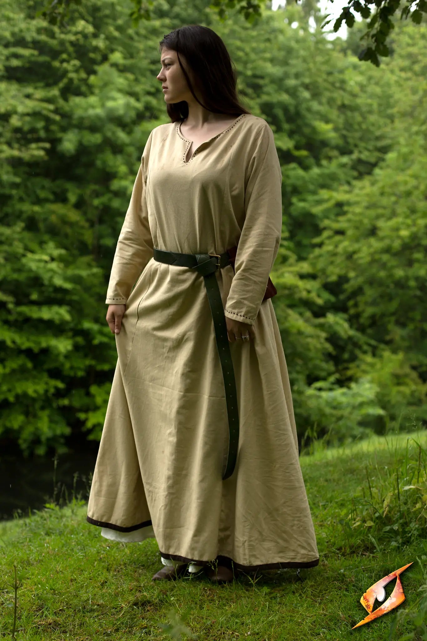 A model wearing a Basic Dress in a natural setting, showcasing comfort and elegance amidst greenery.