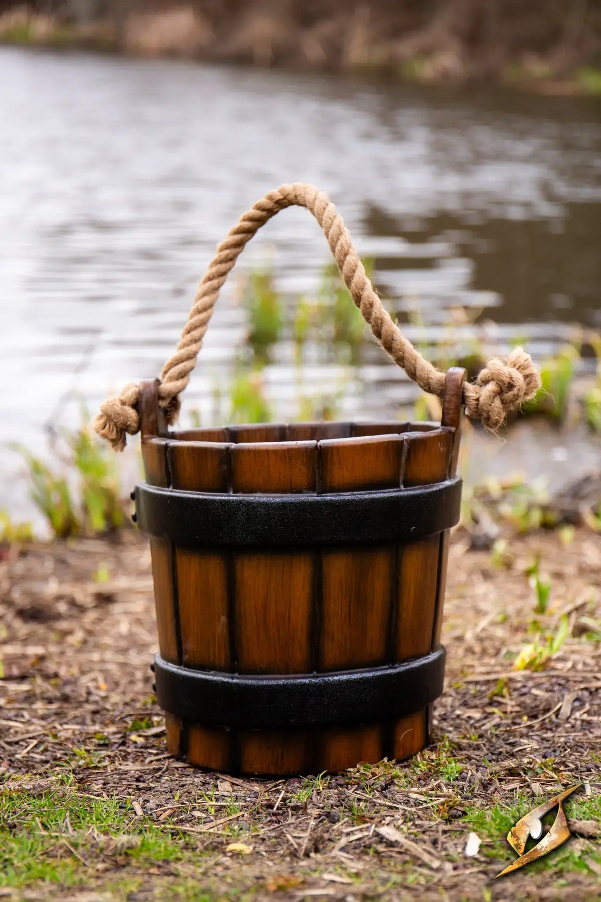 Water Bucket crafted with realistic wooden texture and rope handle, perfect for medieval themed activities and decorations.