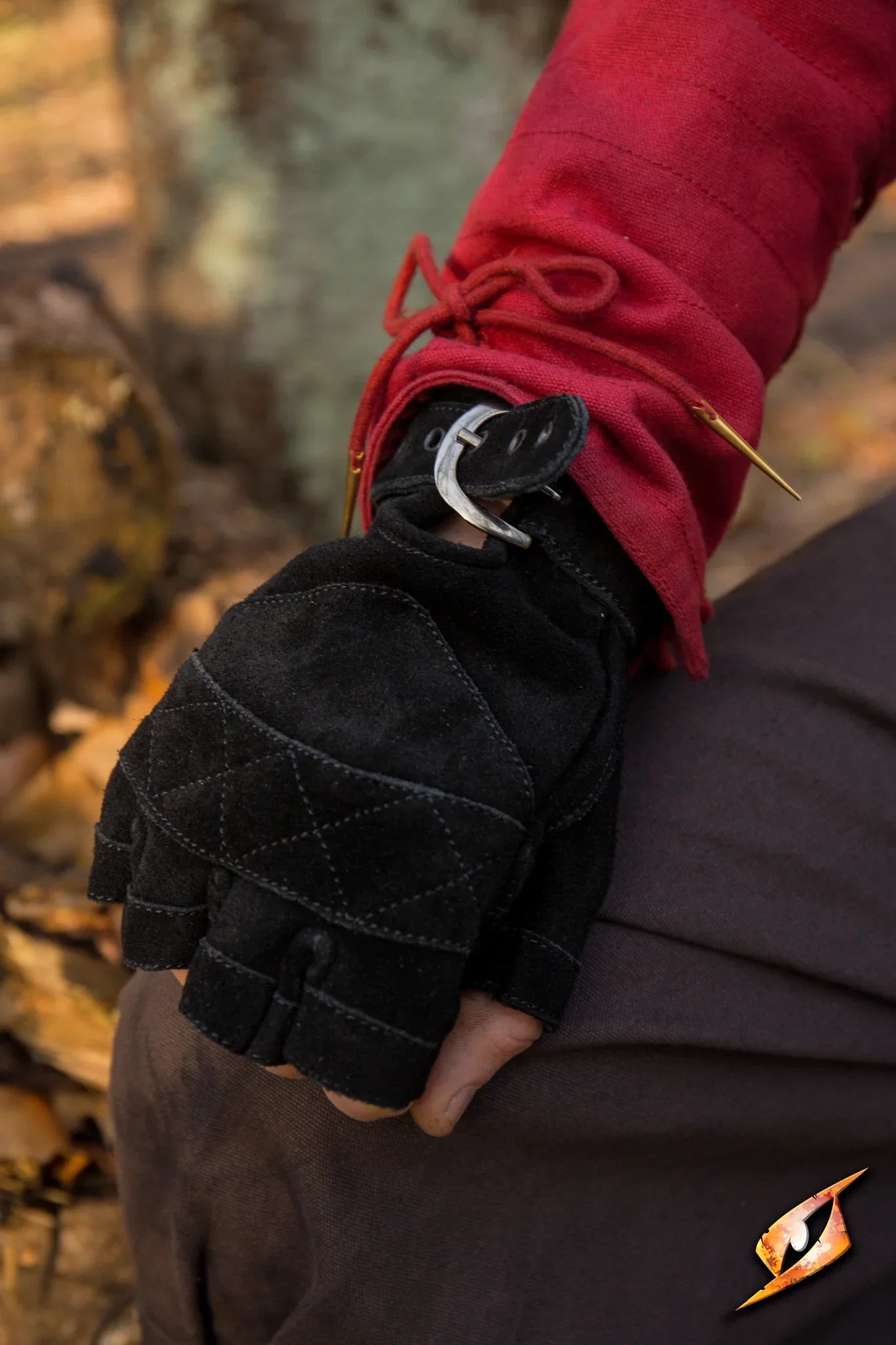 Celtic Gloves Suede in epic black, fingerless design with short cuffs worn on a person's hand.