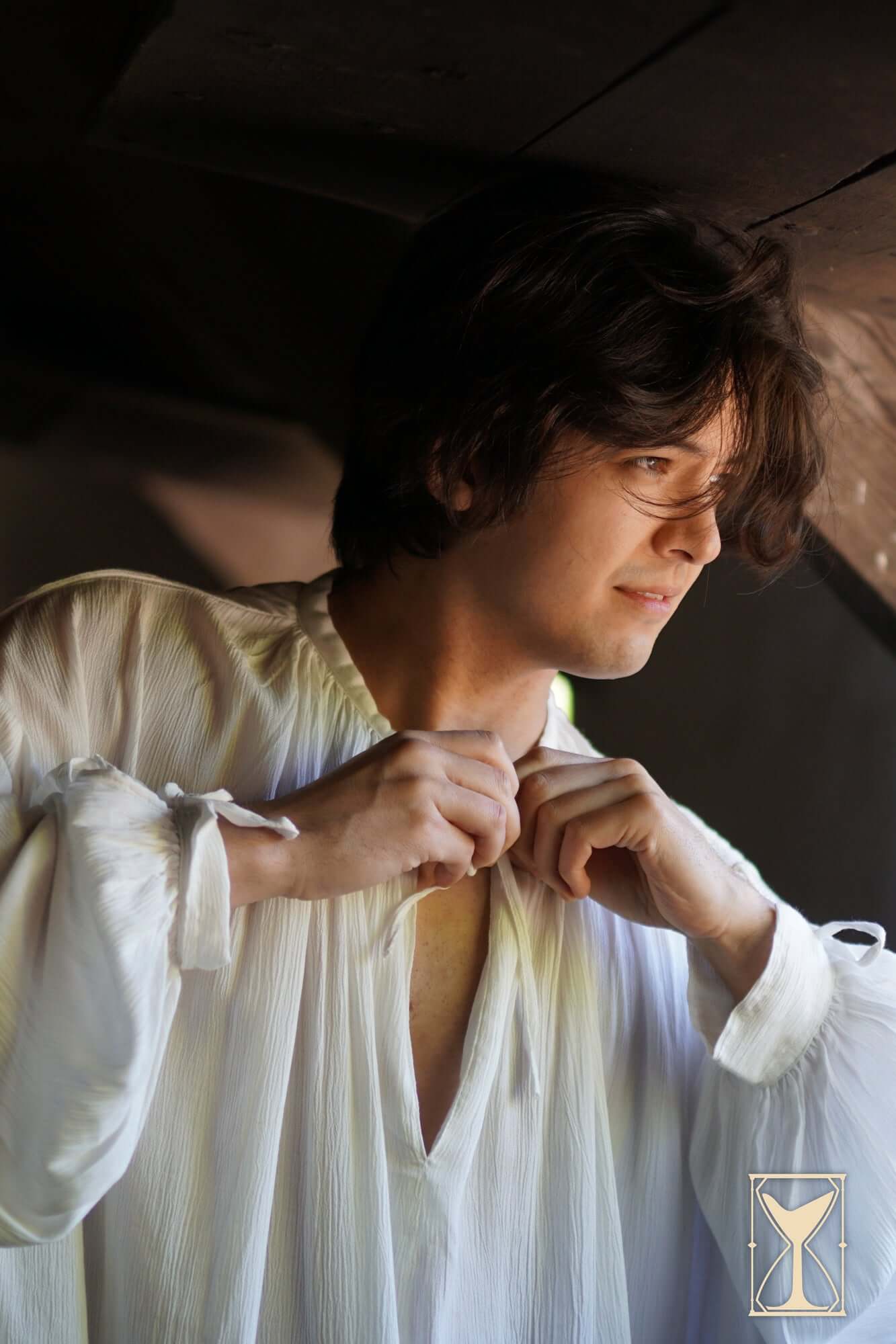 Man wearing Shirt Bartholomew, a relaxed-fit, classic piece of 13th-16th century apparel.