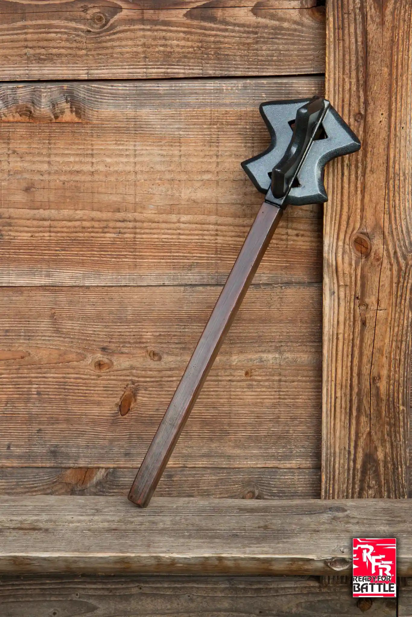 Ready For Battle Mace resting against a wooden wall, showcasing its design and craftsmanship.