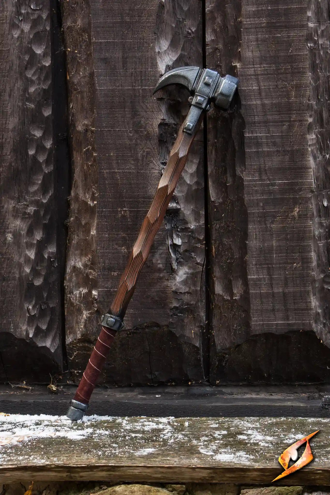 Warhammer - 85cm latex war hammer leaning against wooden wall, featuring an octagonal hammerhead and claw-like spike.