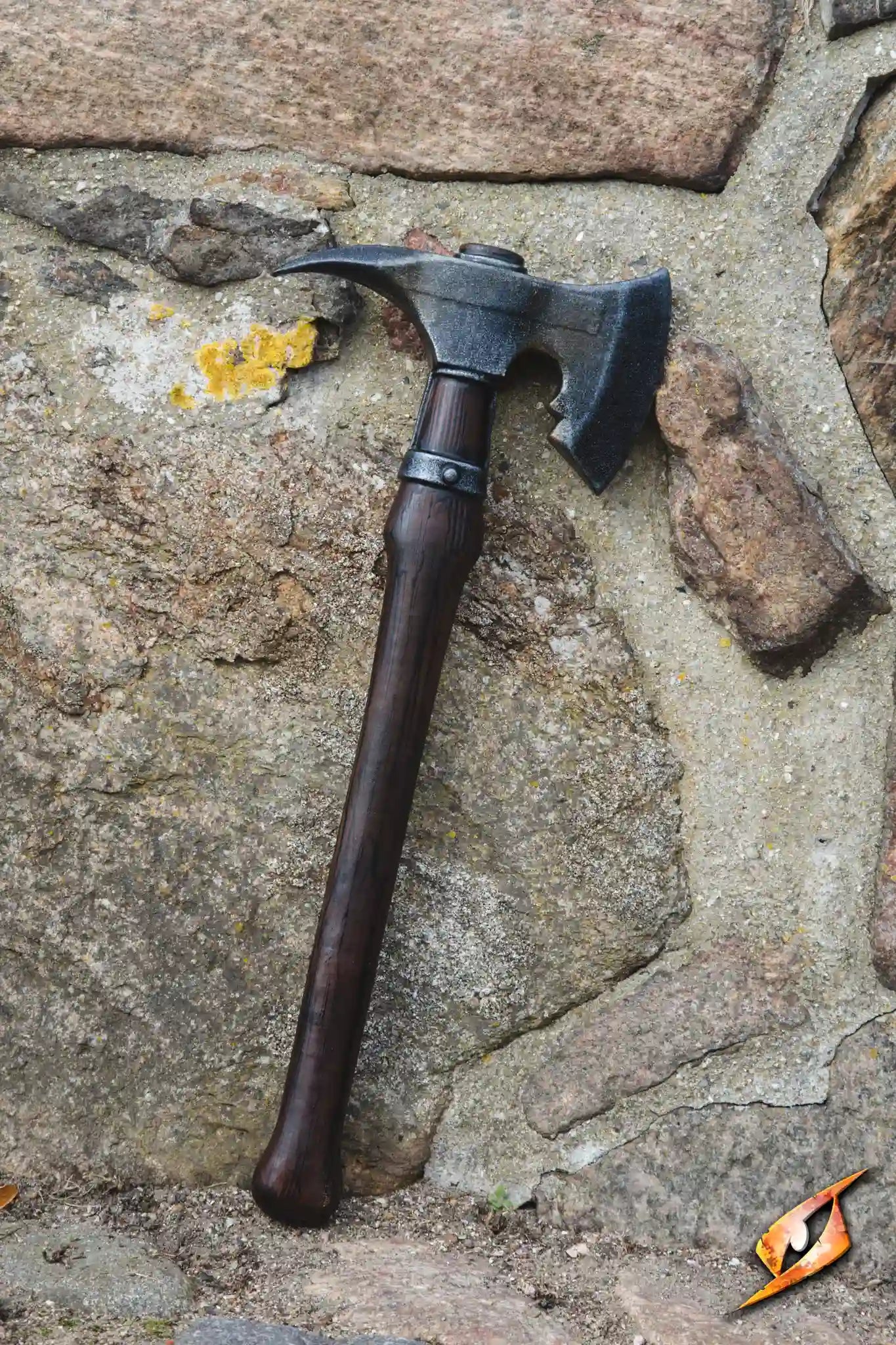 Boarding Axe - 62 cm displayed against a stone wall, showcasing its realistic foam design and craftsmanship.