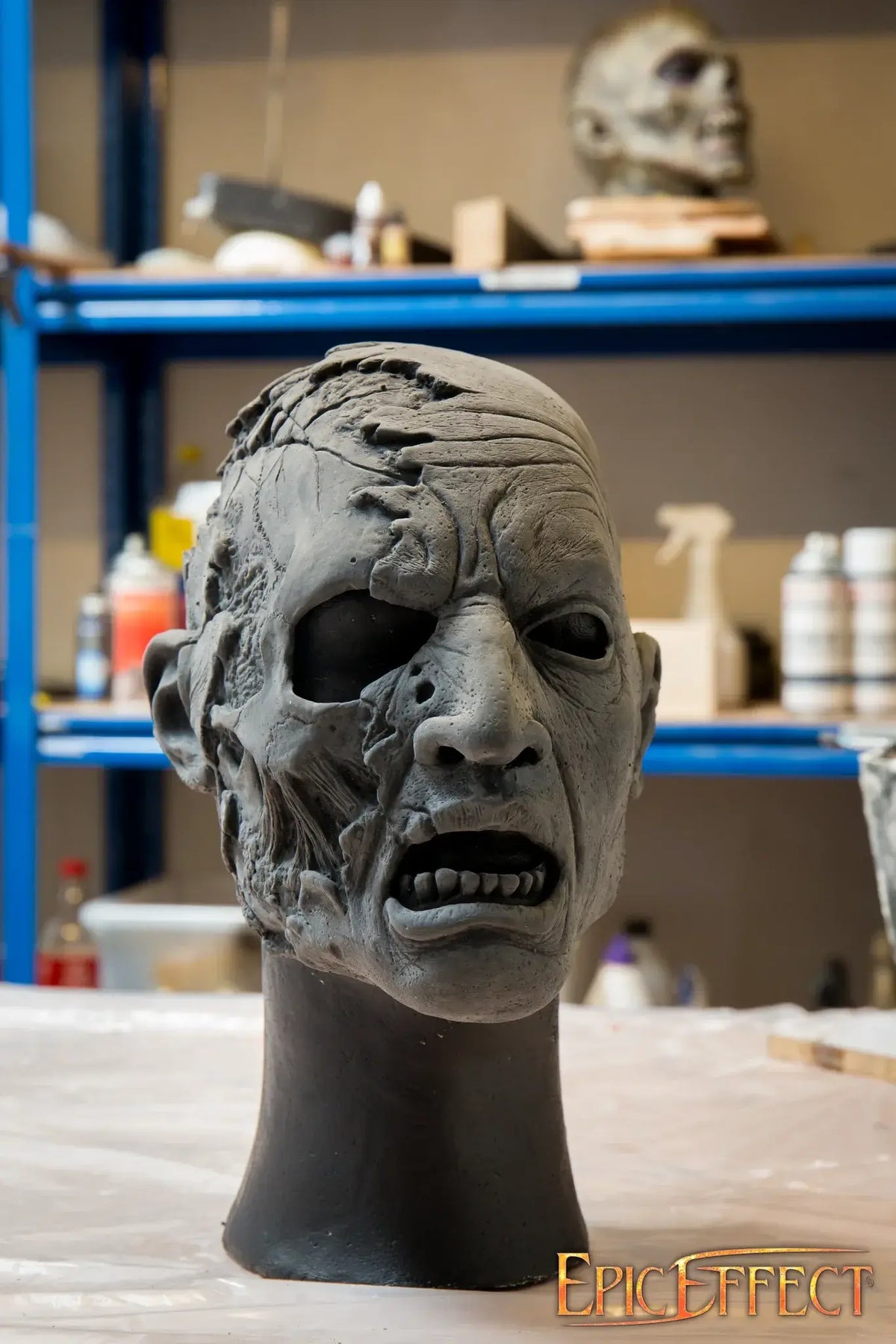 Half Face Zombie sculpture showing detailed features of decay and hunger in a horror-themed design.