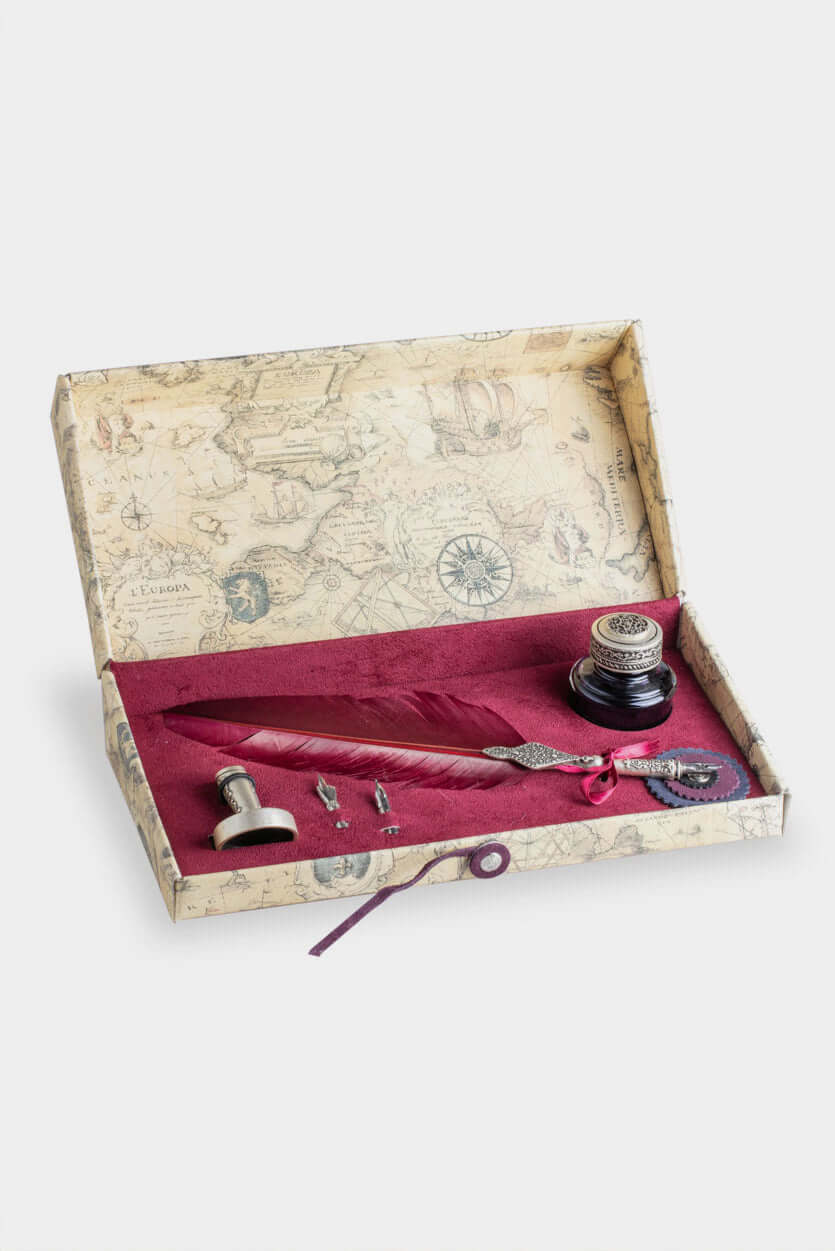 Calligraphic Writing Set featuring a metal-adorned feather pen, ink pot, and nibs in a decorative box.
