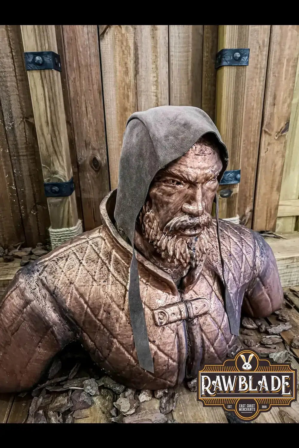Barbadok Leather Coif displayed on a rustic wooden background, showcasing its quality leather and design.