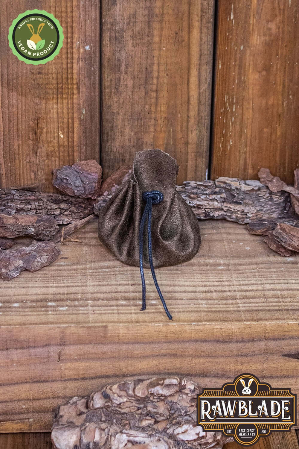 Adventurer's Coin Bag, Leather Free sitting on rustic wood, made of high-quality suede, ideal for coins.