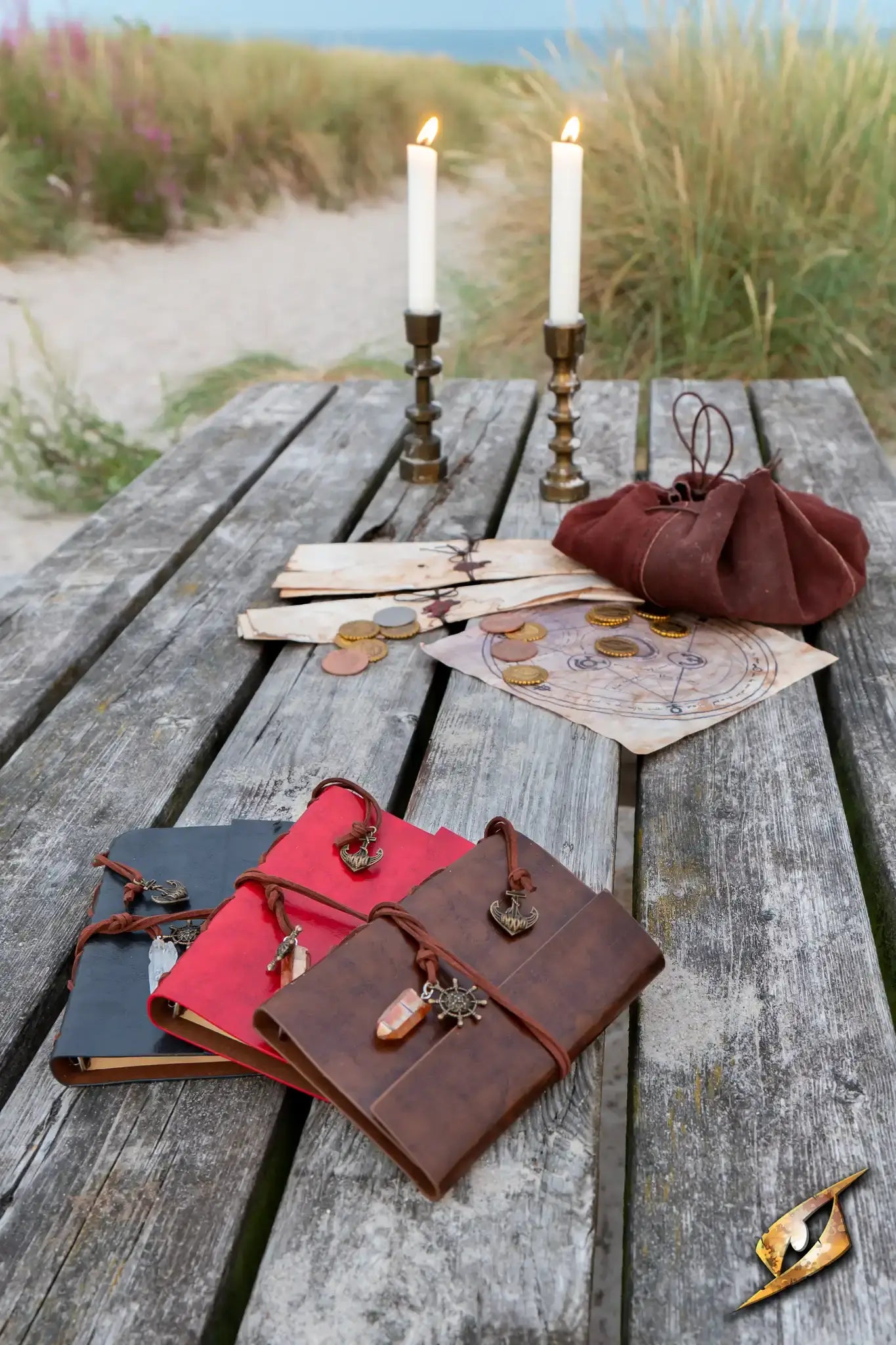 Accessories including journals, coins, and a purse on a rustic wooden table, enhancing LARP and medieval themes.