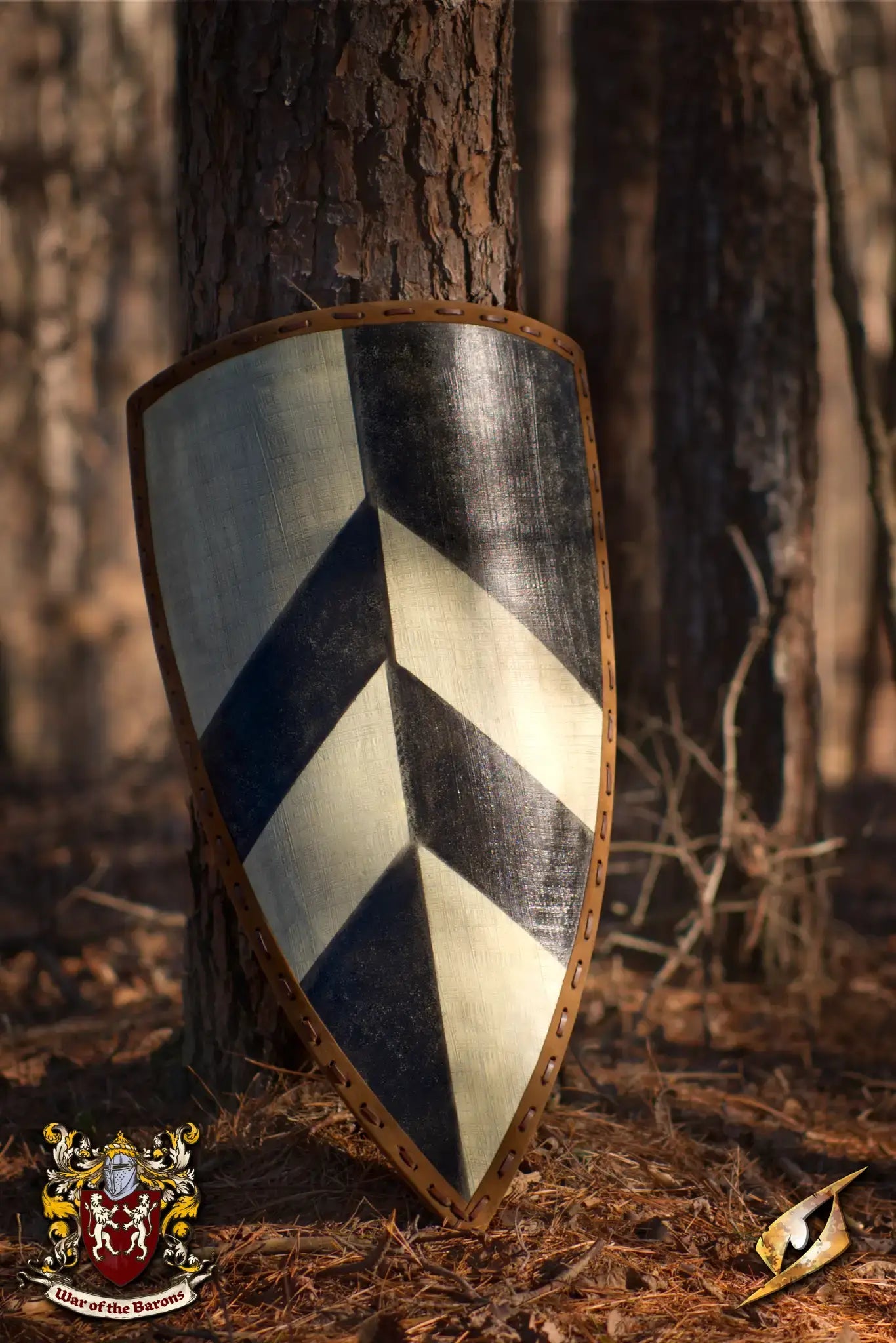 Medieval shield with black and white chevron patterns resting against a tree in a forest, showcasing craftsmanship.