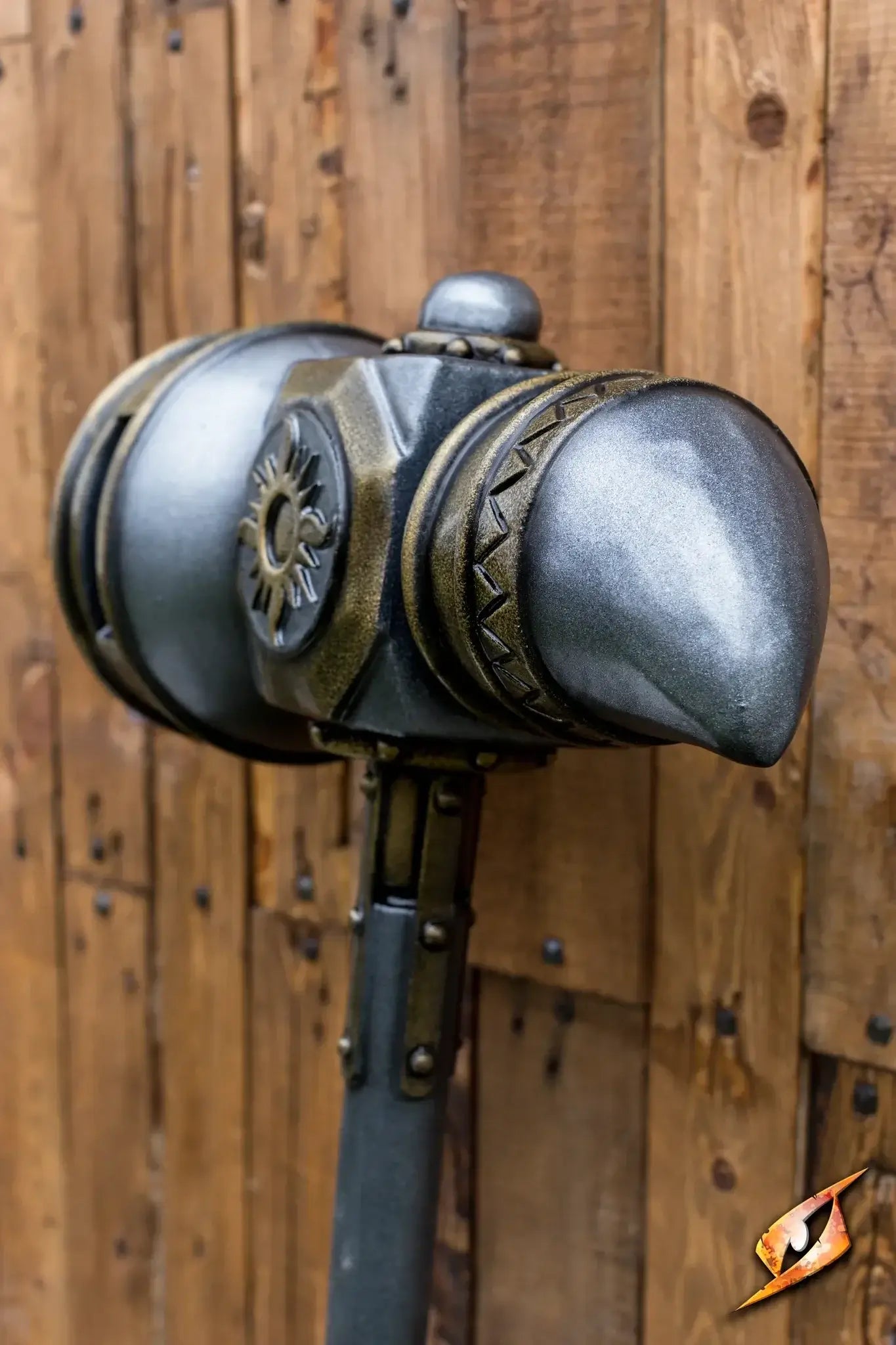Hammers close-up view of a detailed LARP-ready hammer with a metallic finish against a wooden background.