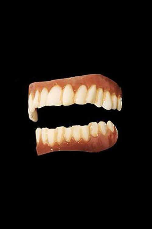 A set of Costume Teeth displayed against a black background, perfect for Halloween costumes and dress-up events.
