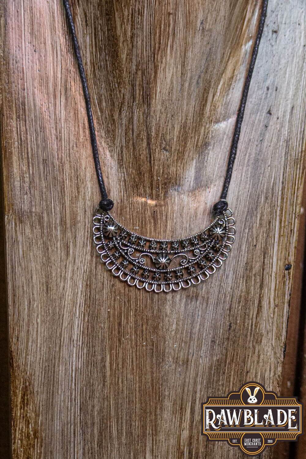 Jewelry piece featuring a beautiful silver necklace with intricate designs, perfect for LARP costumes.