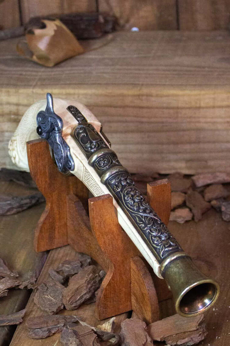 Replica Firearms displayed on a wooden stand, showcasing intricate design and craftsmanship.