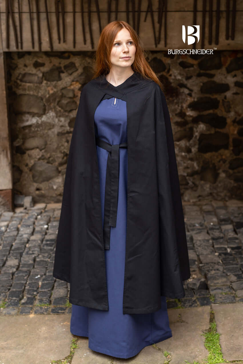 Model wearing the Cape Morpheus by Burgschneider, featuring striking straps and lightweight design.
