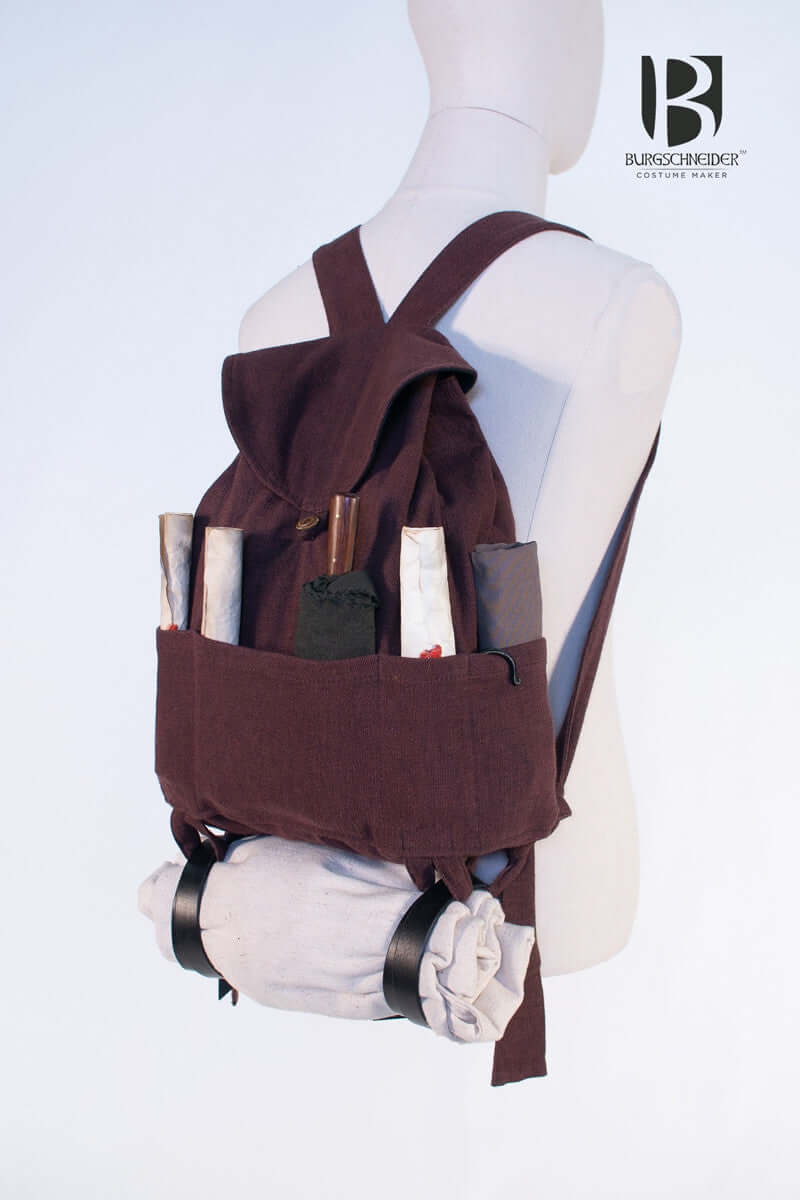 Backpack Capsus with rolled scrolls and sticks, perfect for LARP and travel essentials.