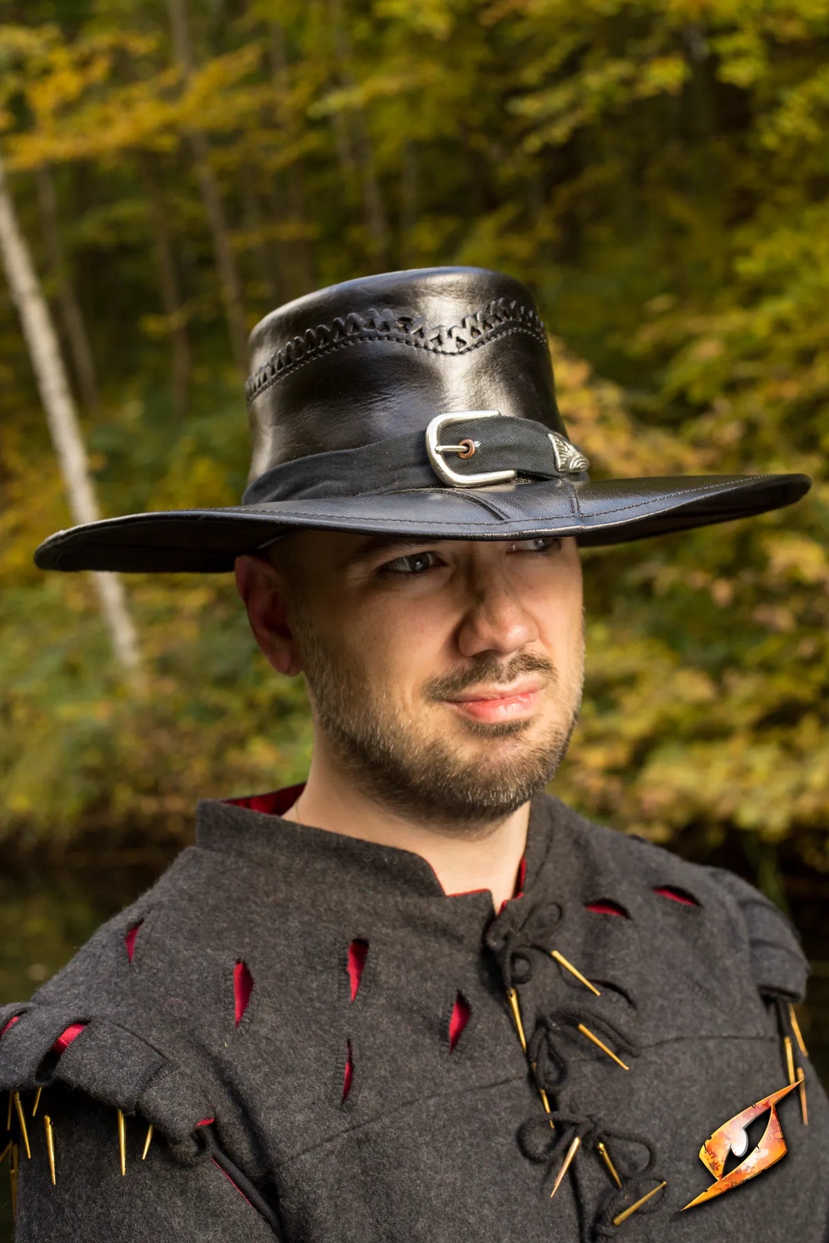 Man wearing an Epic Black Witch Hunter Hat from Epic Armoury, showcasing gothic style with a leather pentagram.