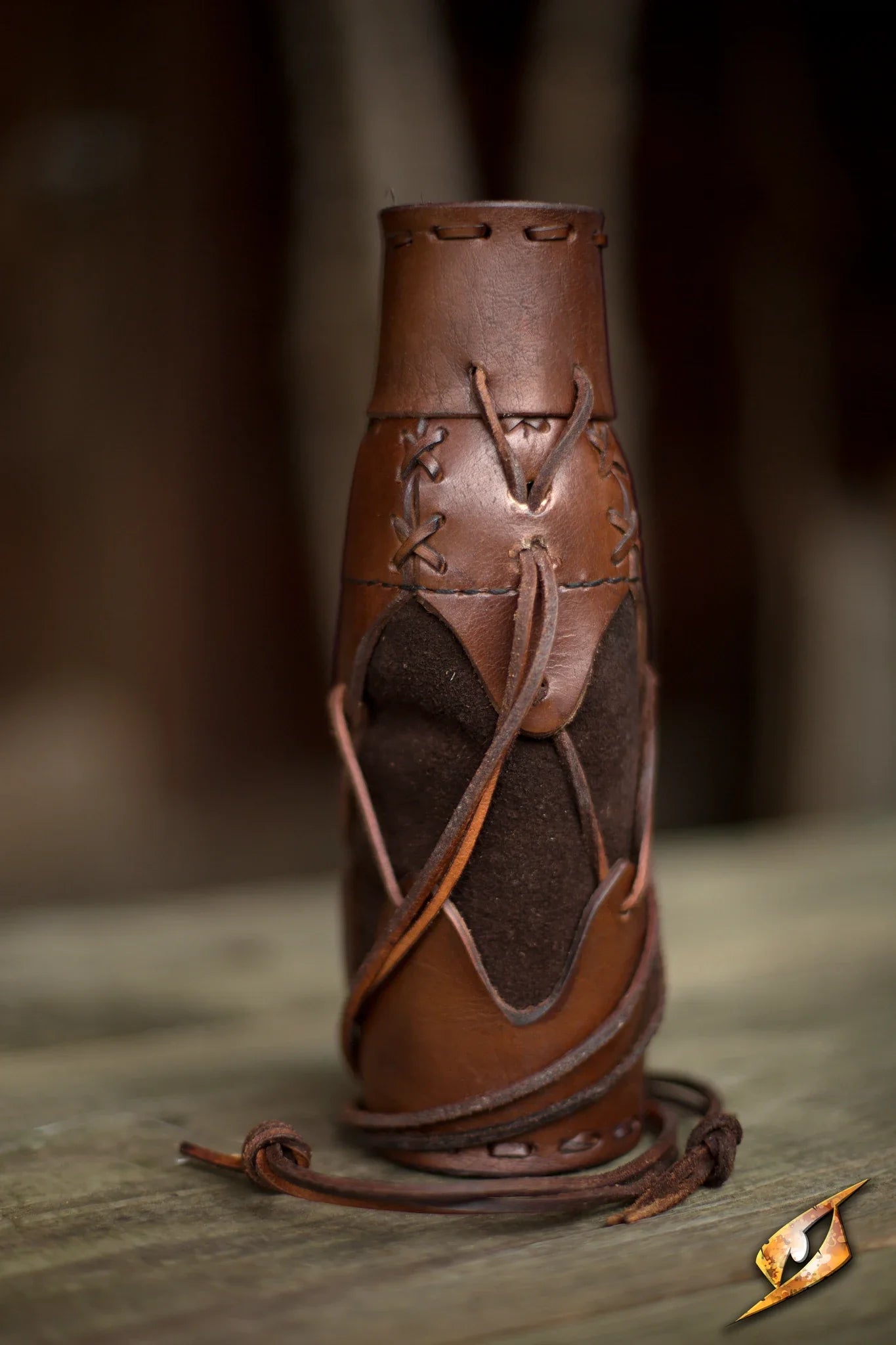 Laced Bottle Holder crafted from leather and suede for a rugged look and functionality.