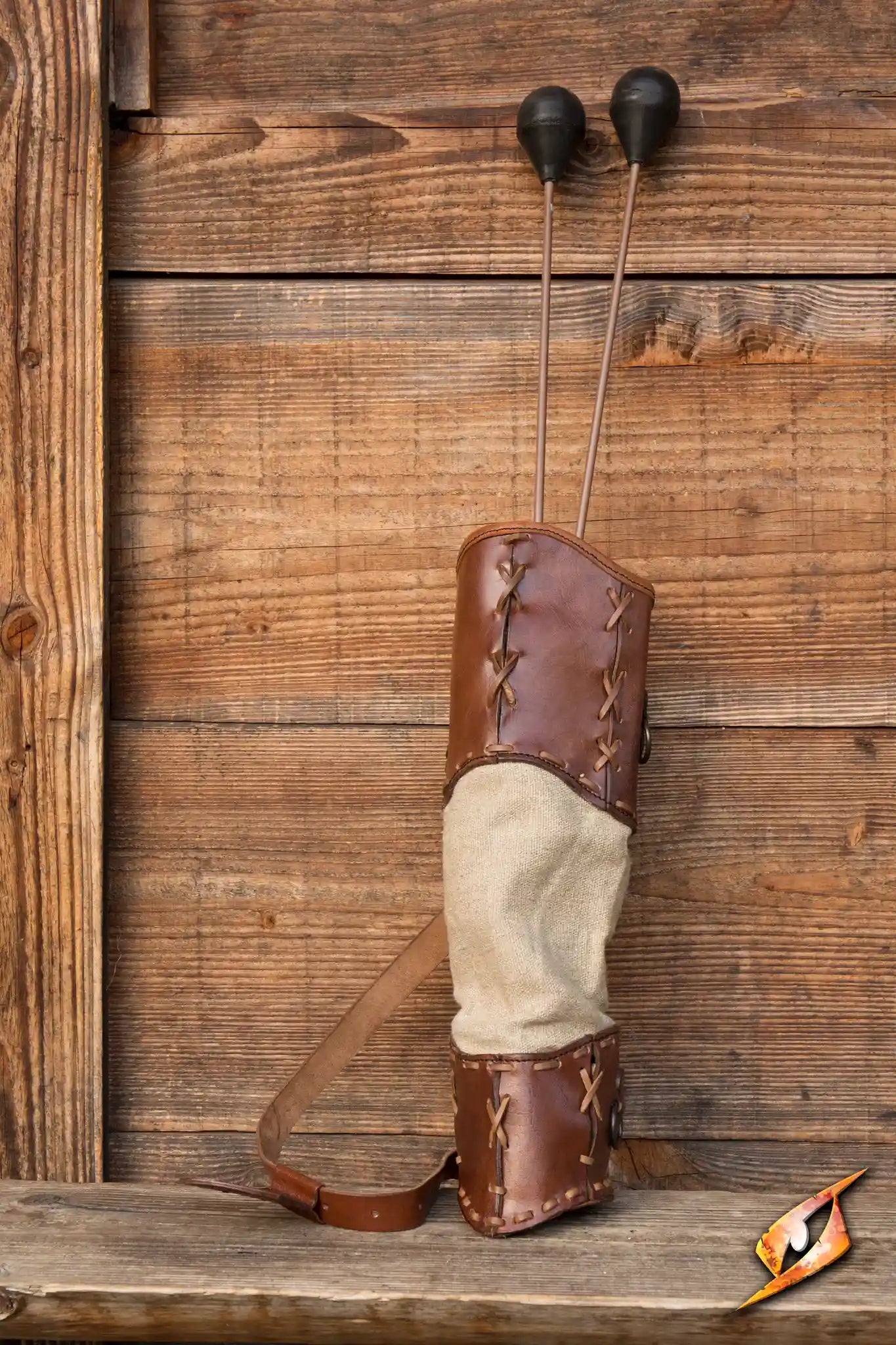 Wildling Quiver with leather and beige canvas for LARP arrows, rustic design against wooden background.