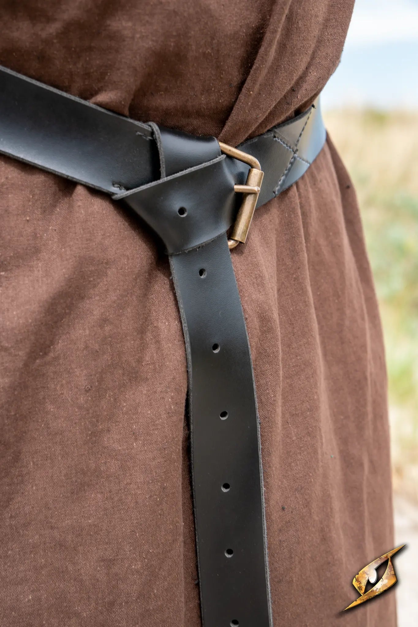 X Belt - Faux Leather fastened on a brown outfit with adjustable holes for a perfect fit.