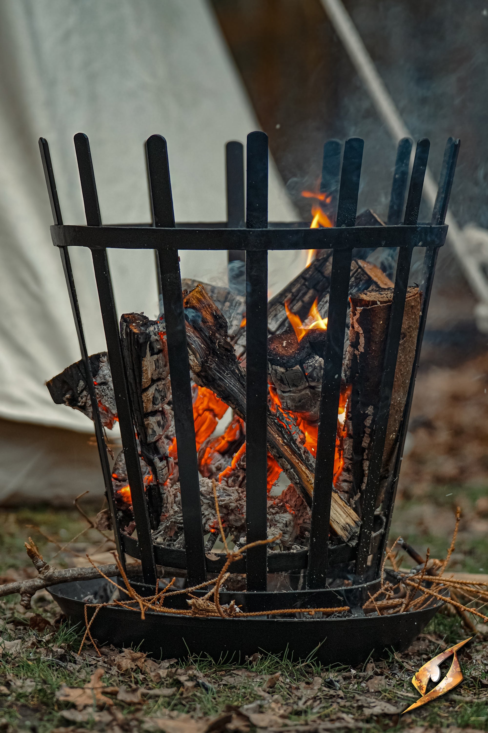 Camp Warmer W. Metal Tray - Roman in use, showcasing flames and campfire setup.