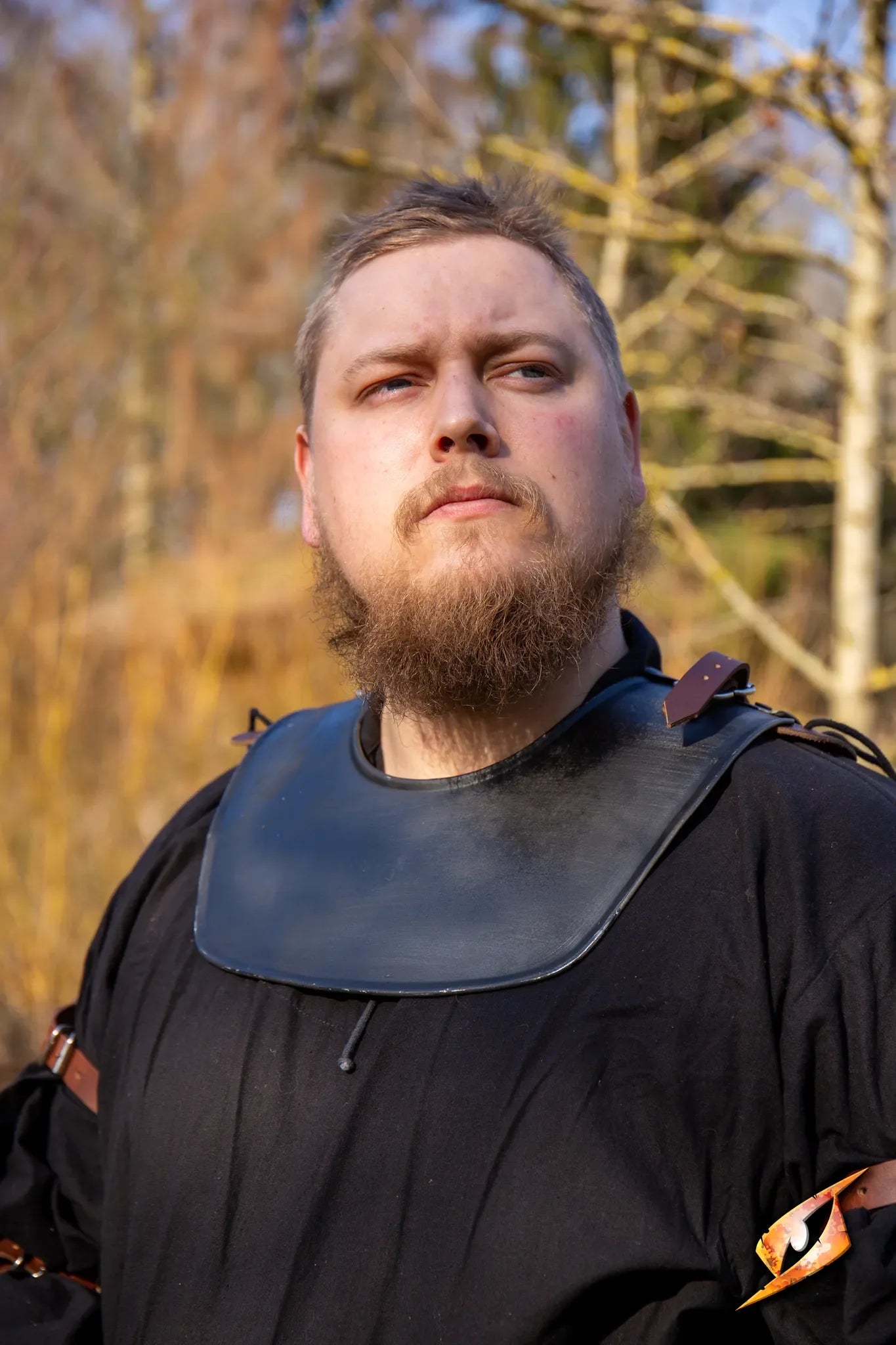 Soldier Gorget worn by a man in a black tunic, showcasing its simple design and great protection outdoors.