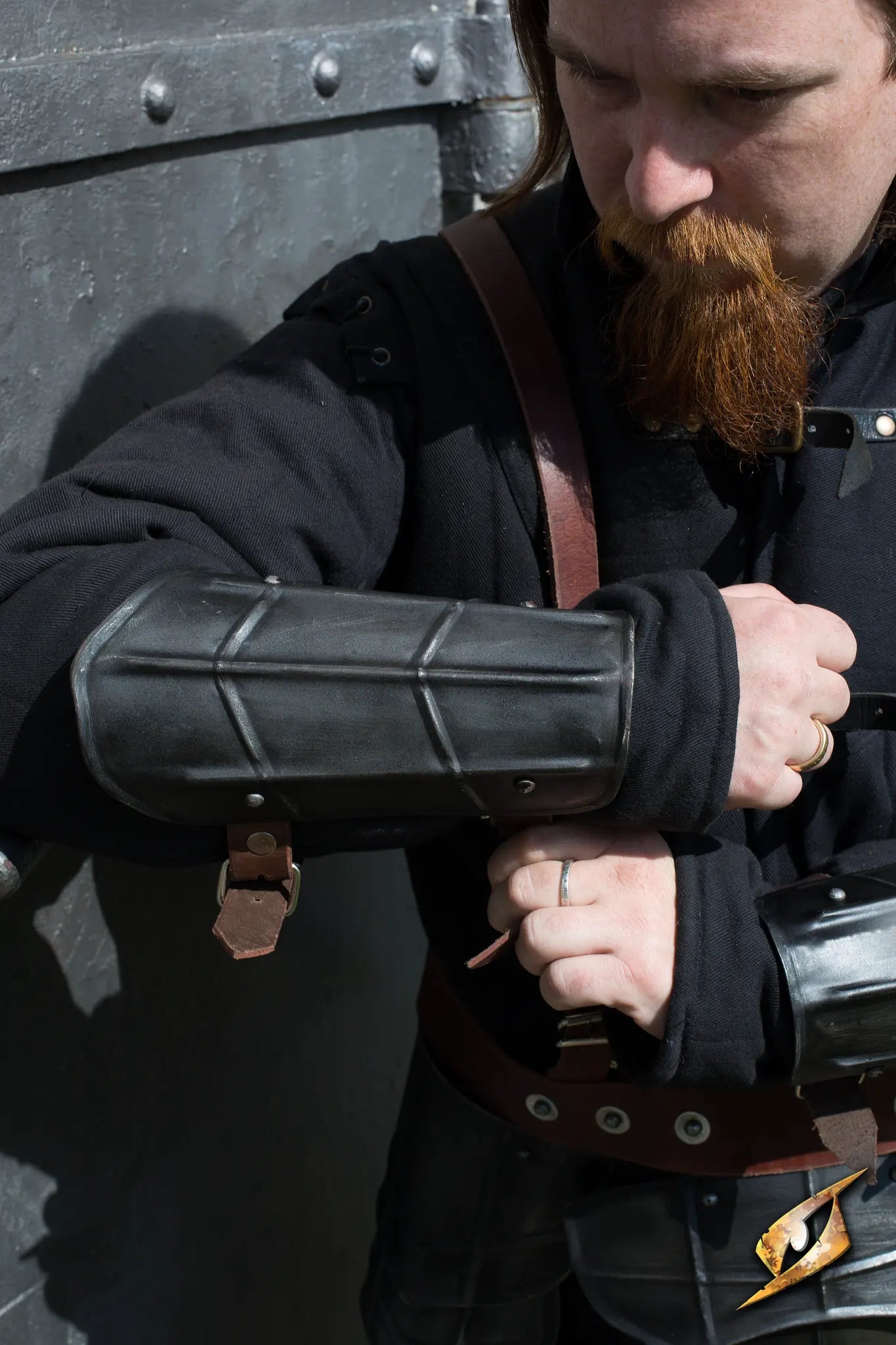 Arm Protection Drake worn by a soldier, showcasing dark armor and enhancing intimidation on the battlefield.