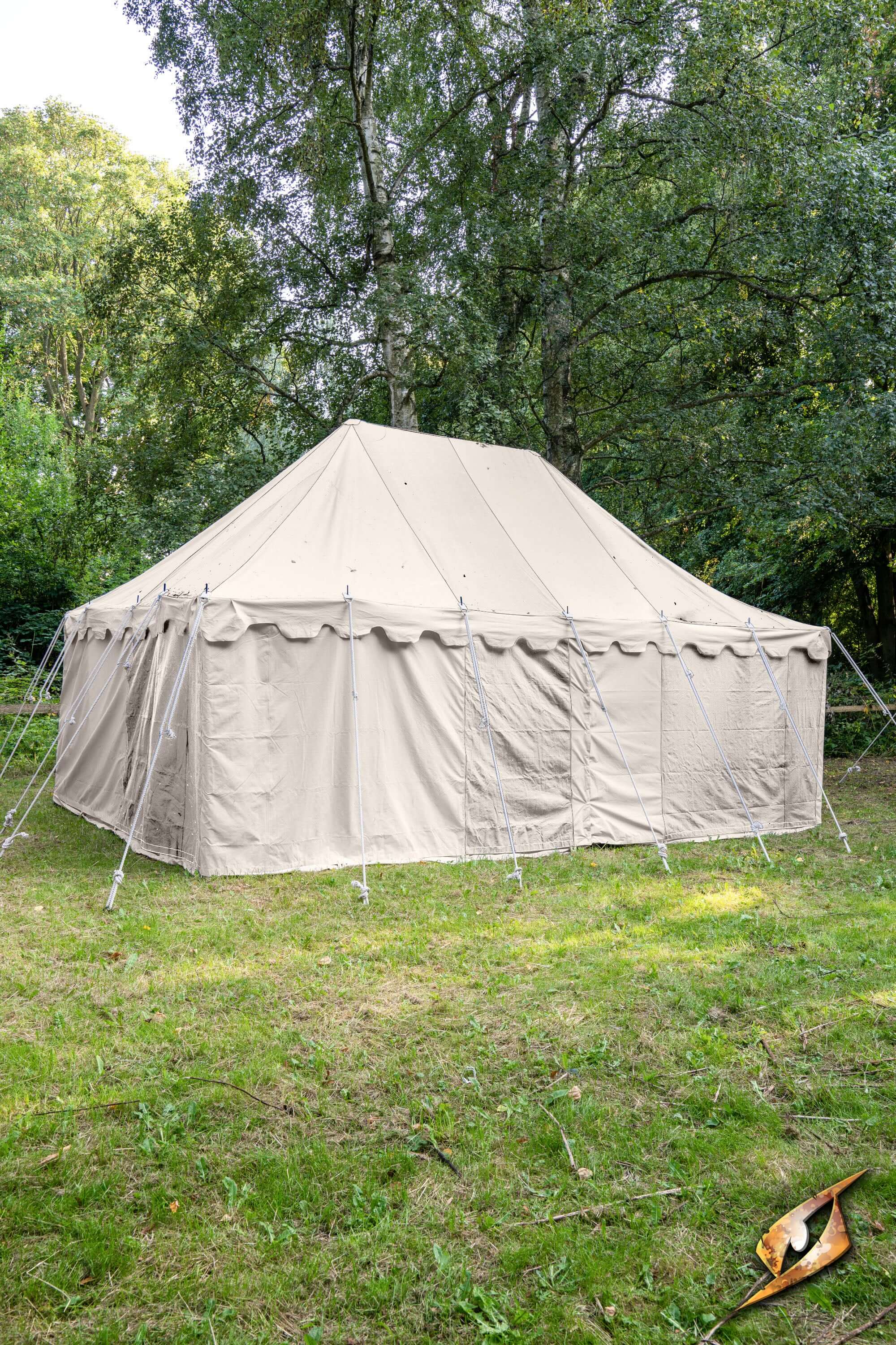 Marquee Tent - 4x6m set up in a grassy area surrounded by trees, ideal for outdoor events and gatherings.