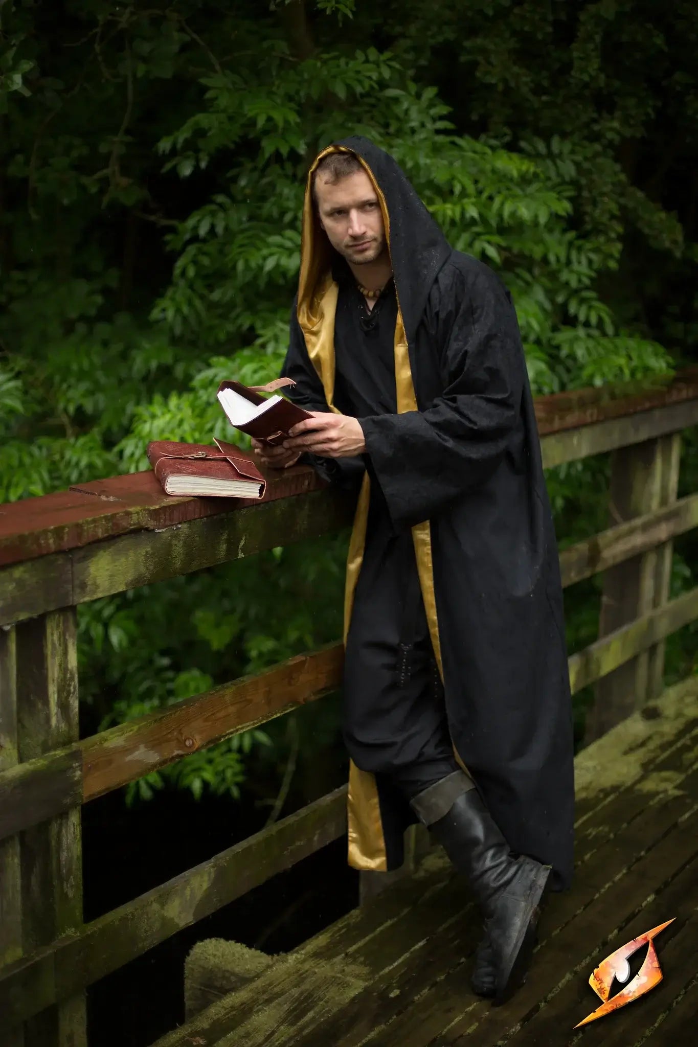 A magician wearing a Magician Robe stands on a bridge, reading from a spellbook amid lush greenery.