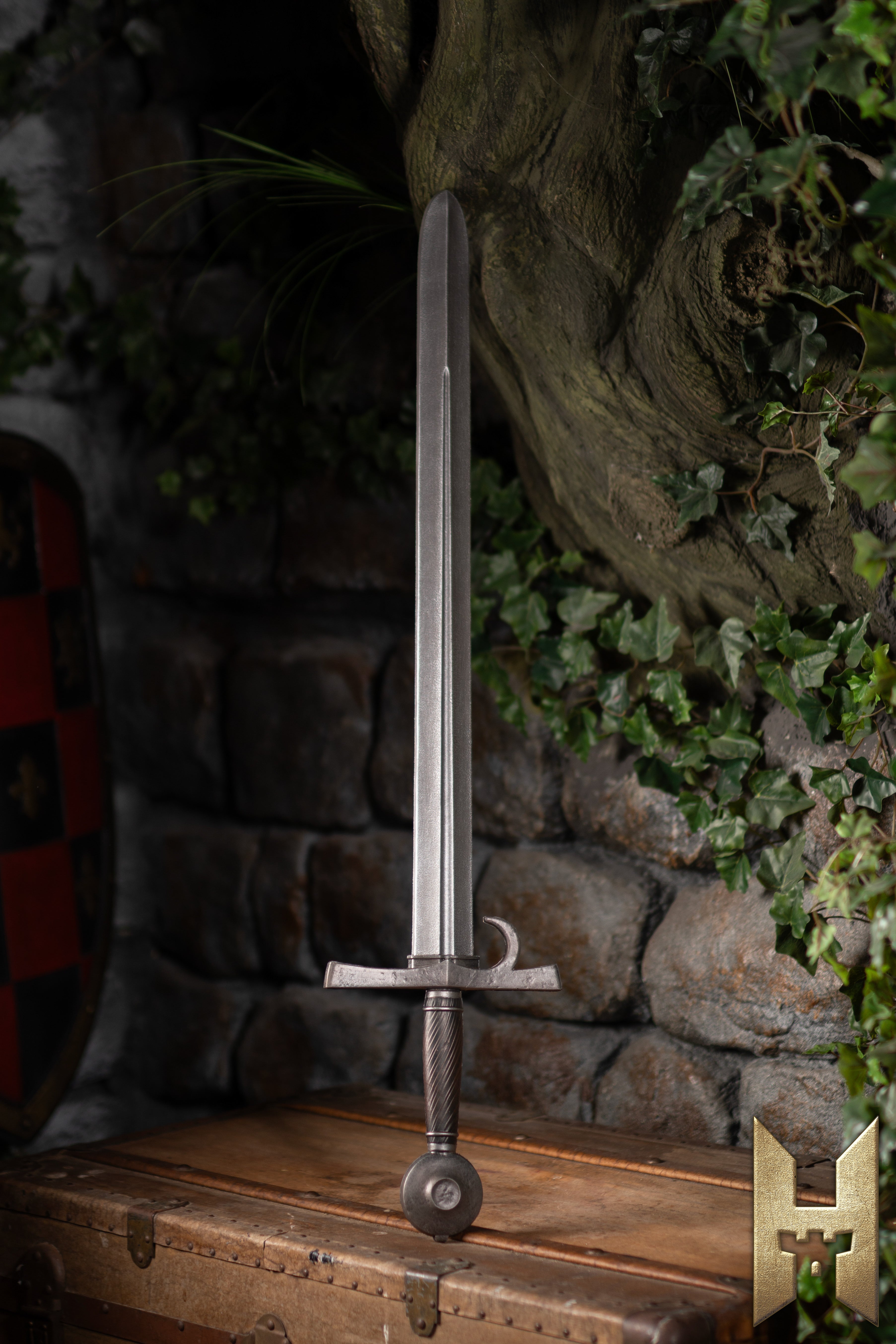 Milanese Sword displayed against a stone wall, showcasing Renaissance design and LARP construction from Epic Armoury.