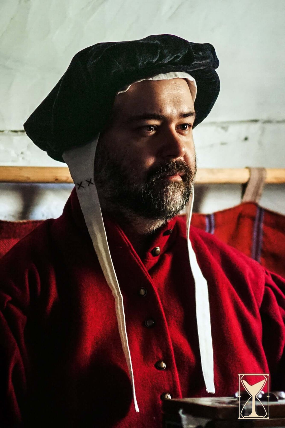 Man wearing a Beret Francisco, a velvet headpiece inspired by 15th and 16th-century fashion.