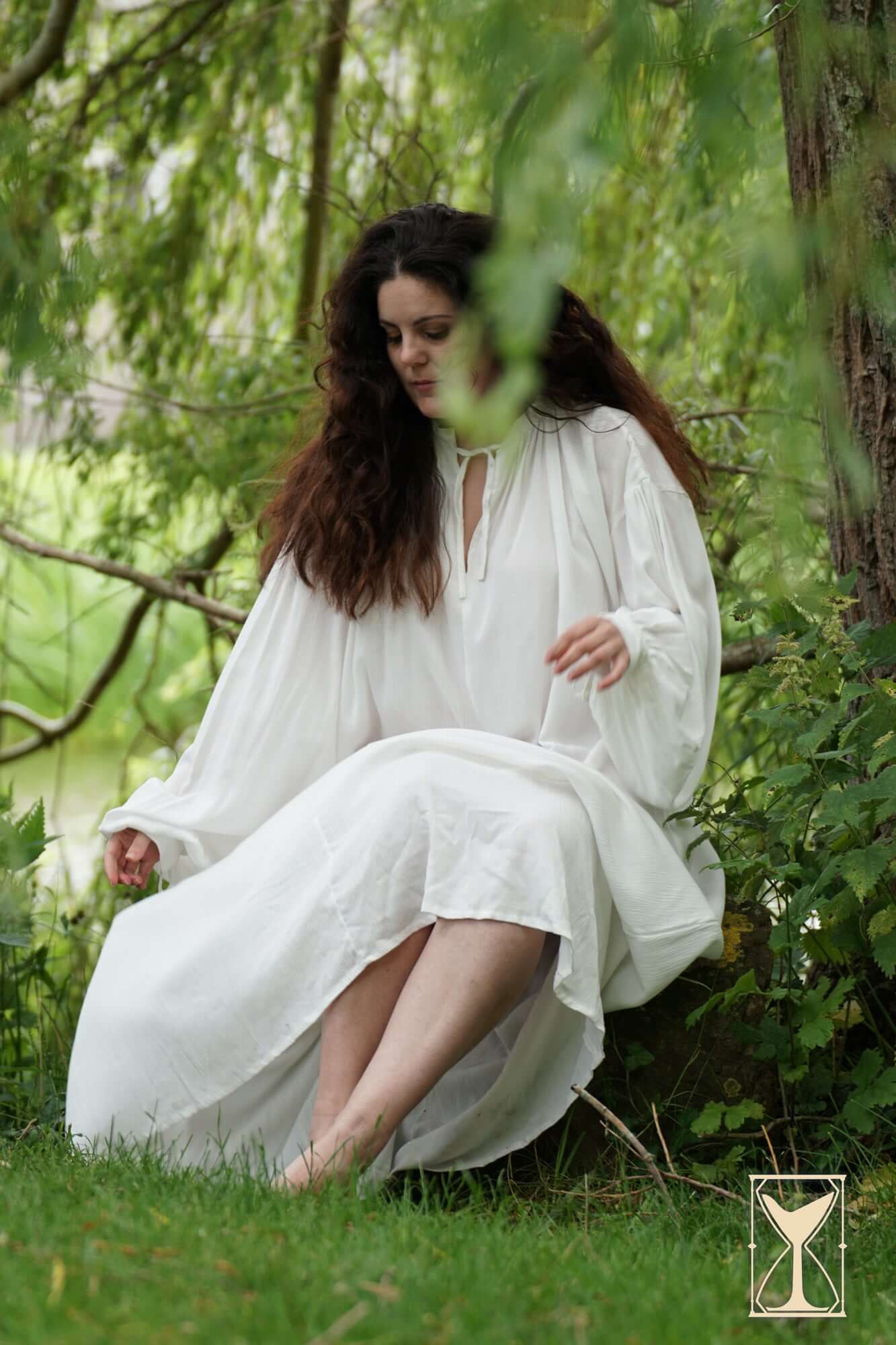 Smock Violet light and lovely medieval undergarment worn outdoors, showcasing a loose-fitting white chemise in nature.
