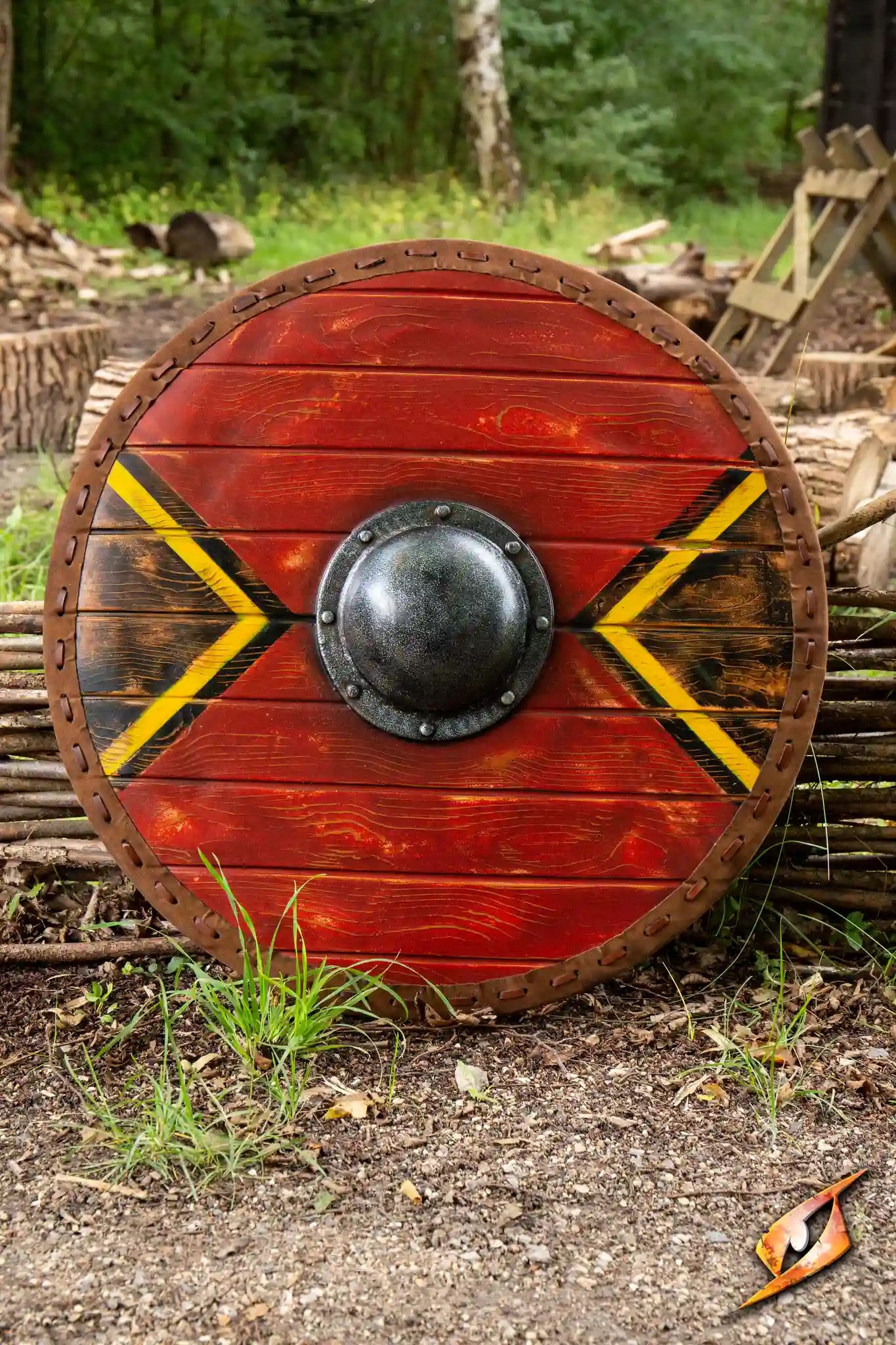 Thegn Shield, a 70 cm round latex shield with red and yellow design, ideal for coastal raids and offensive fighting.