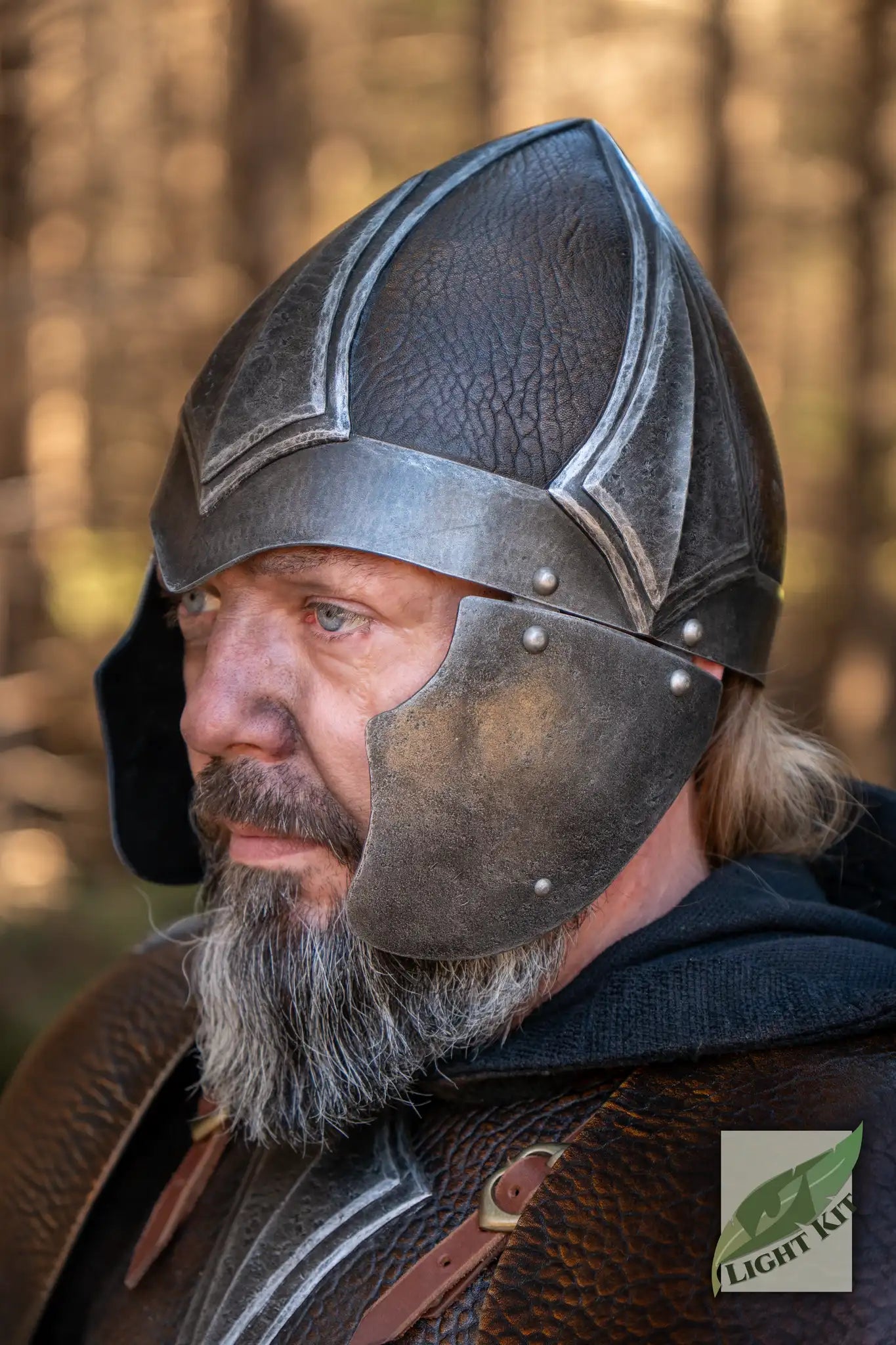 Barbarian Helmet PU - M worn by a warrior, showcasing its dark leather texture and steel reinforcements.