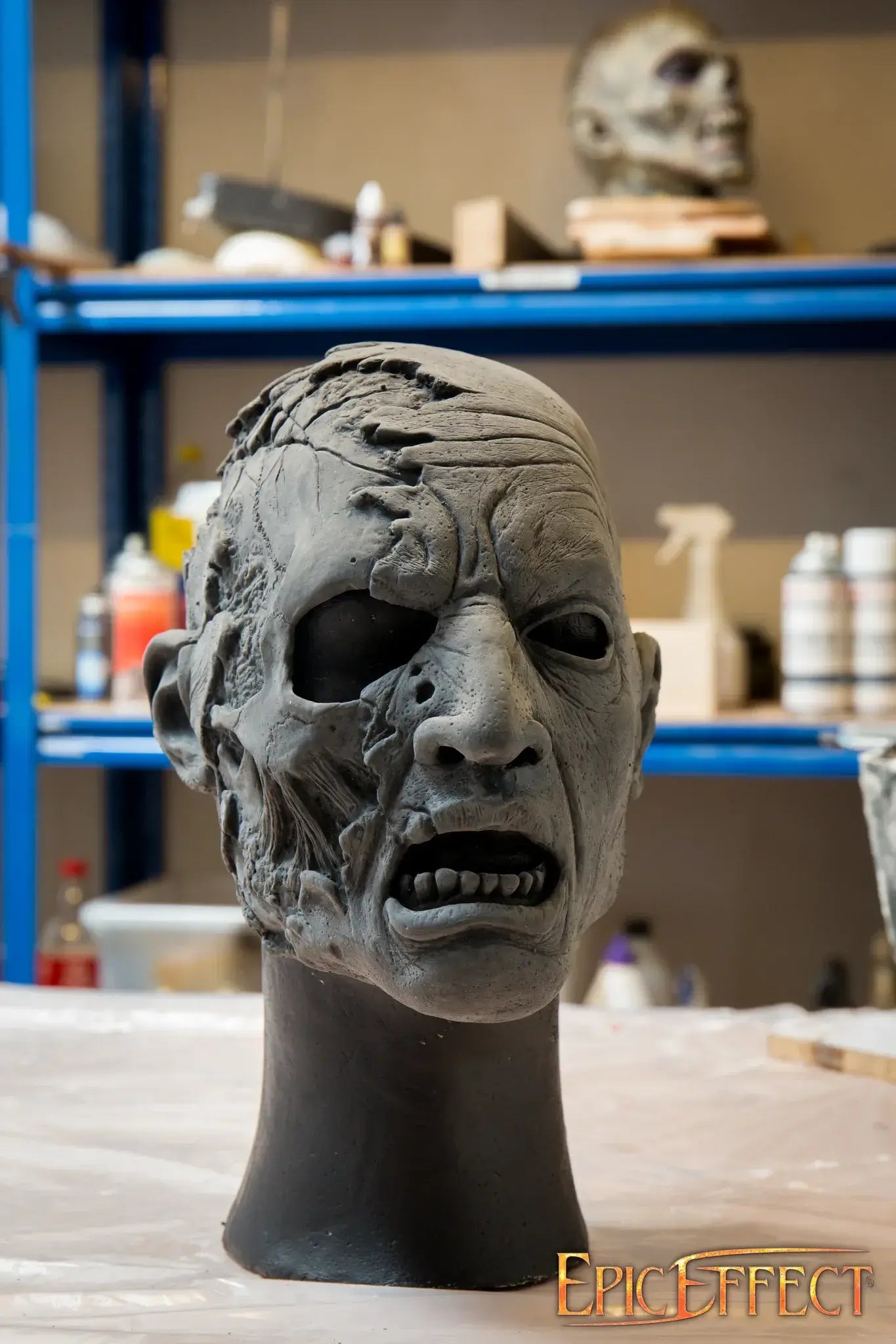 Half Face Zombie sculpture showing detailed features of decay and hunger in a horror-themed design.