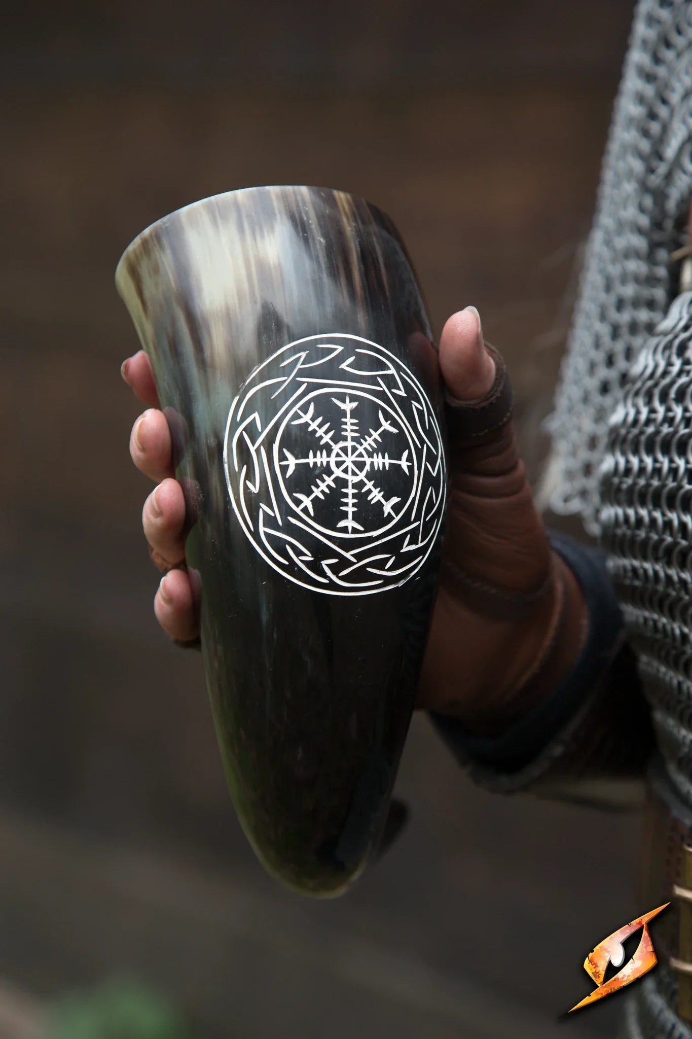 Aegishjalmur Horn held in hand, showcasing its intricate design and authentic bull horn craftsmanship.