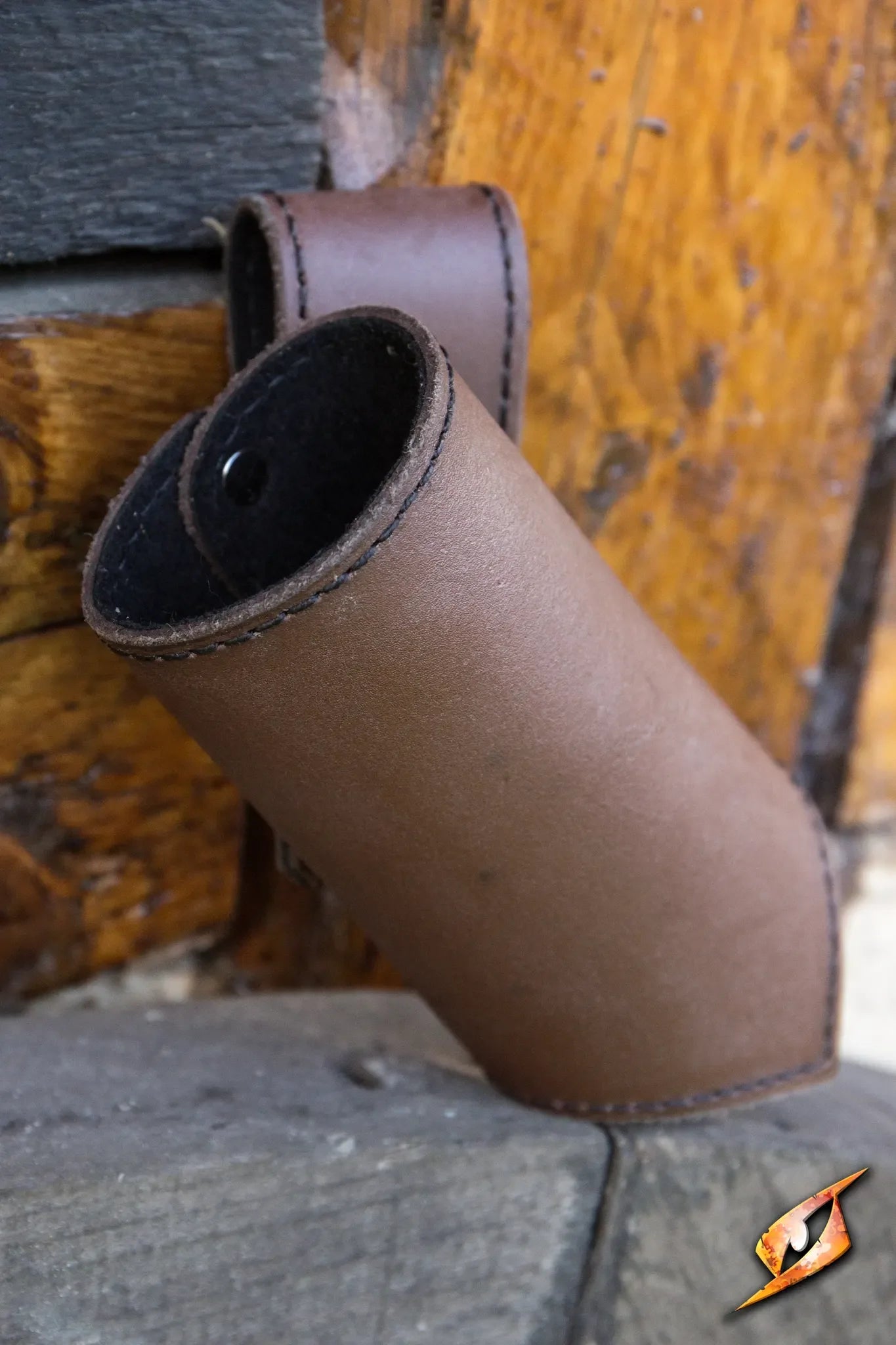 Close-up of a Sword Holder made of brown leather, designed for secure storage of swords for adventurers.