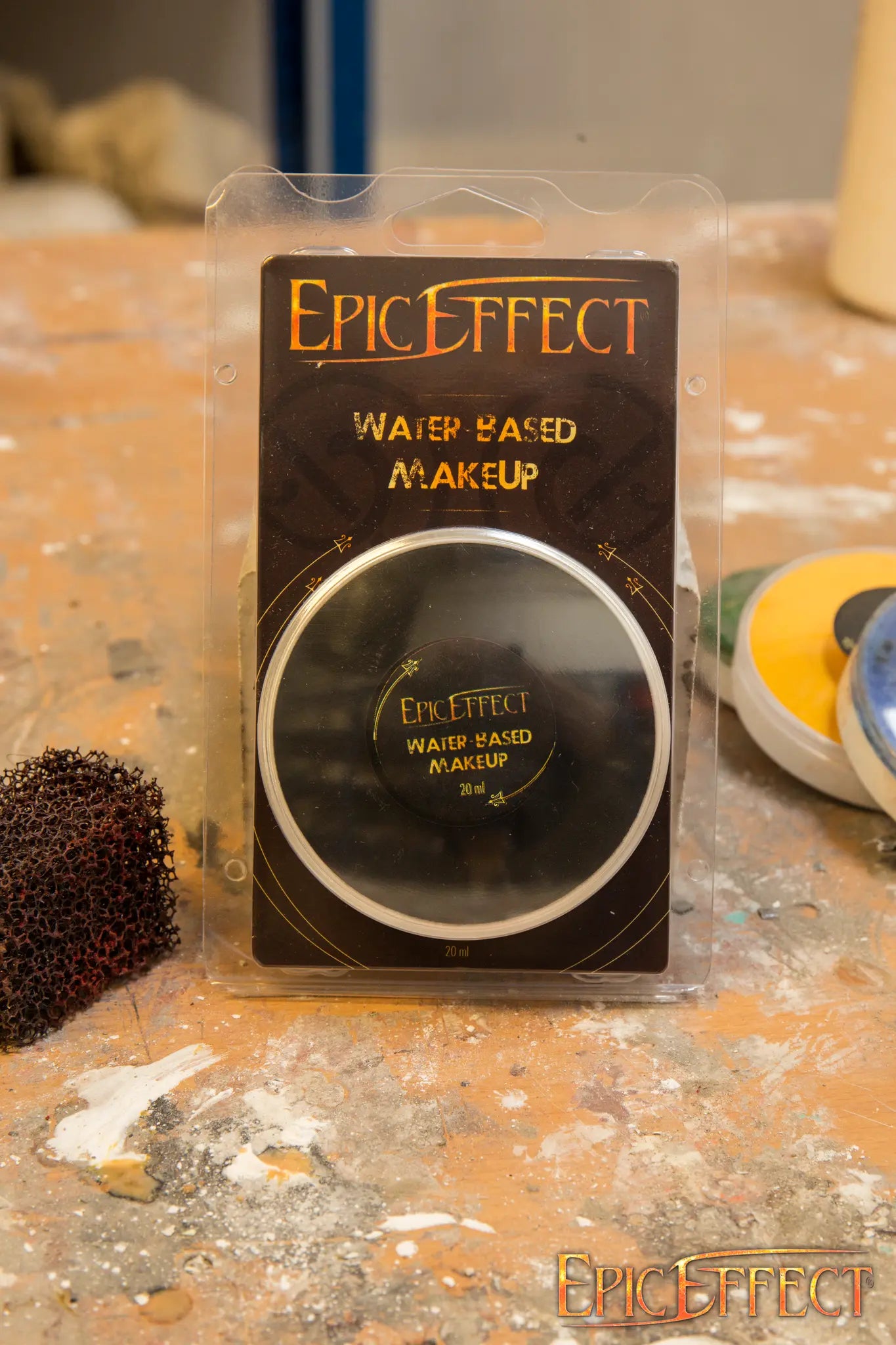 Epic Effects Water Based Make Up - Black in packaging on a work surface, showcasing the product label.