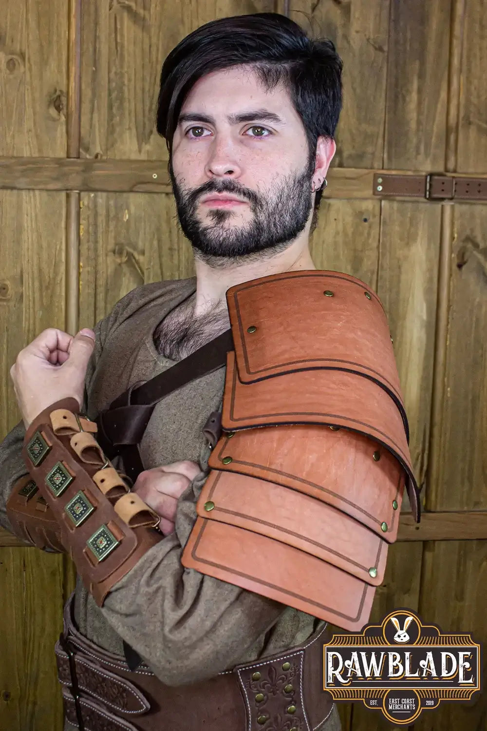Adventurer Shoulder pad worn by a man, highlighting its aged leather for a realistic adventure look.