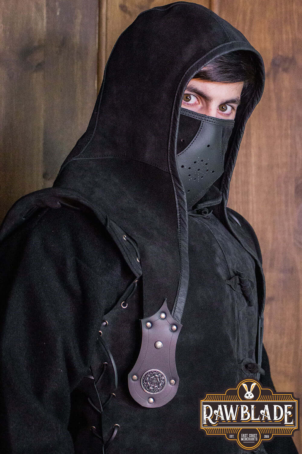 Akku Splitleather Hood worn by a character with a mask and detailed leather accessories, showcasing style and function.